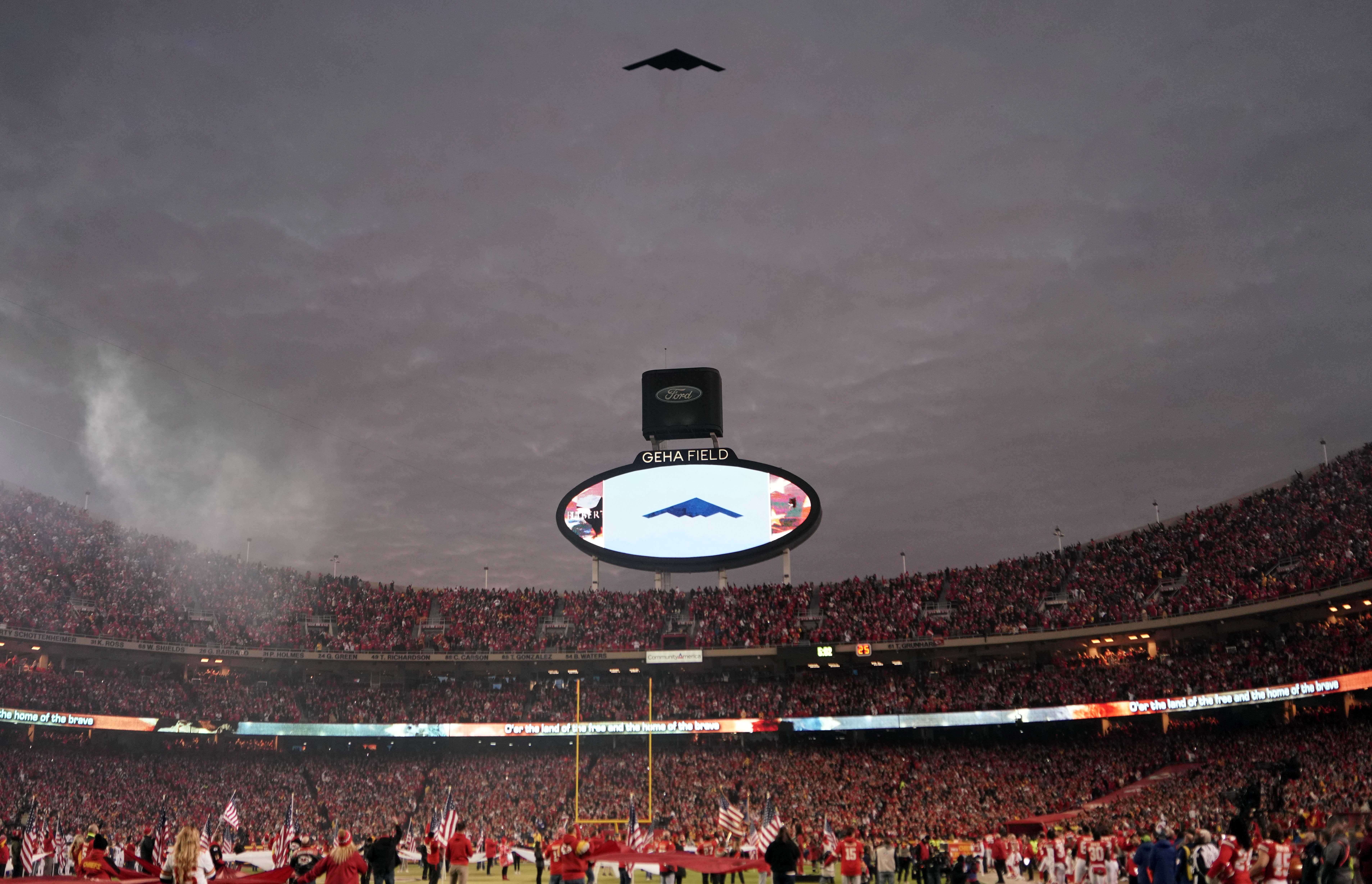 A B-2 bomber performs a flyover before the start of the AFC Divisional playoff football game with the Buffalo Bills and Kansas City Chiefs.