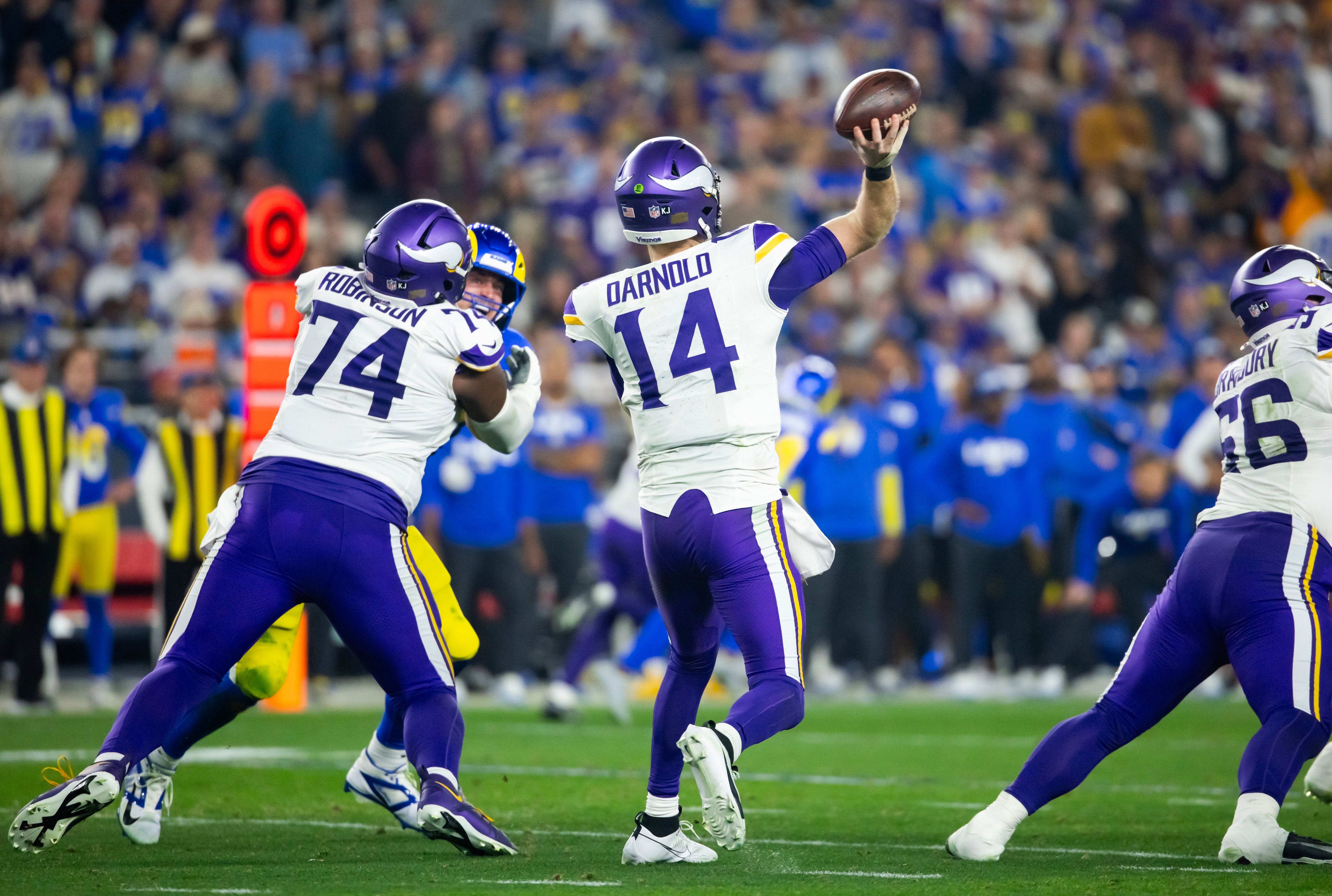 Jan 13, 2025; Glendale, AZ, USA; Minnesota Vikings quarterback Sam Darnold (14) against the Los Angeles Rams during an NFC wild card game at State Farm Stadium.