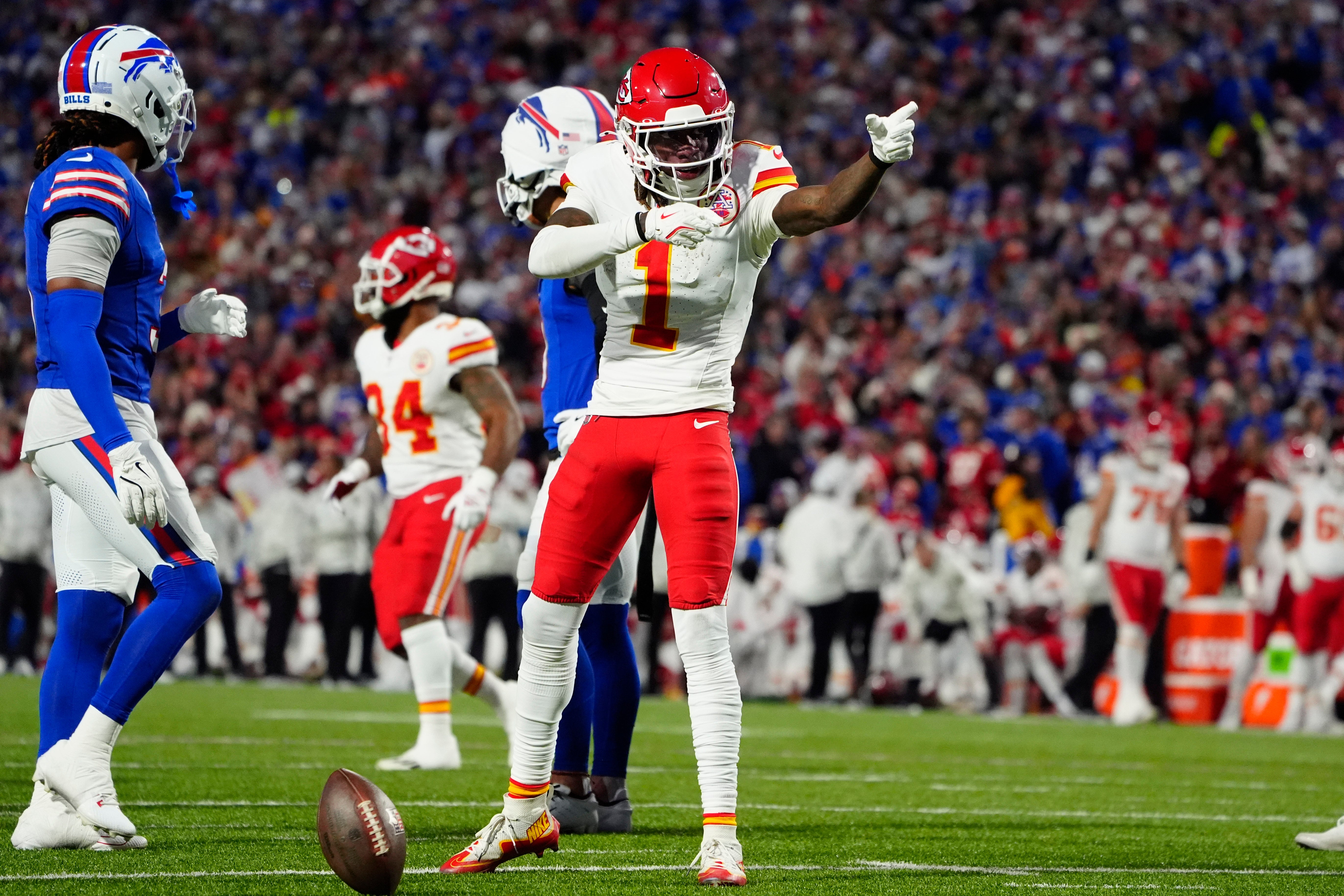 Nov 17, 2024; Orchard Park, New York, USA; Kansas City Chiefs wide receiver Xavier Worthy (1) signals a first down against the Buffalo Bills during the first half at Highmark Stadium.