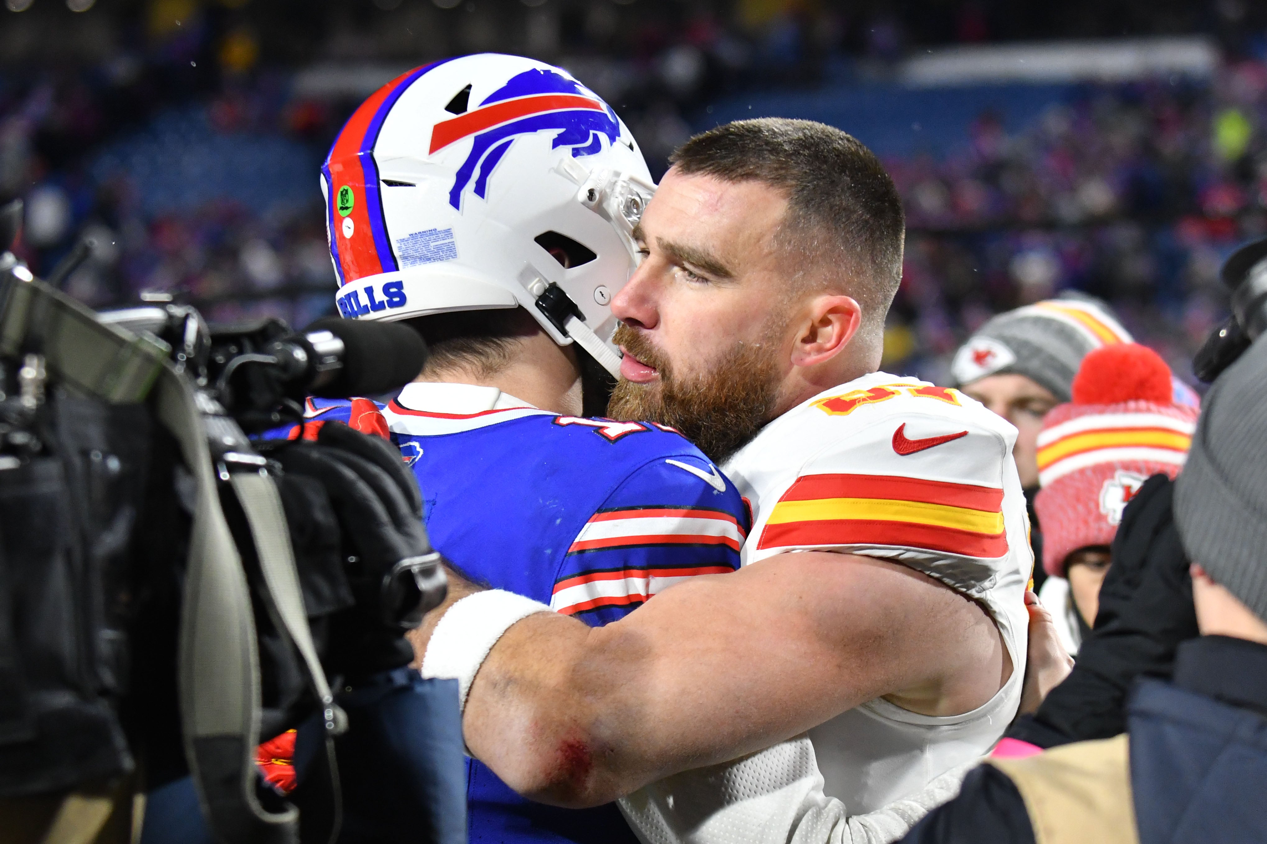 Jan 21, 2024; Orchard Park, New York, USA; Kansas City Chiefs tight end Travis Kelce (87) reacts with Buffalo Bills quarterback Josh Allen (17) after the 2024 AFC divisional round game at Highmark Stadium.