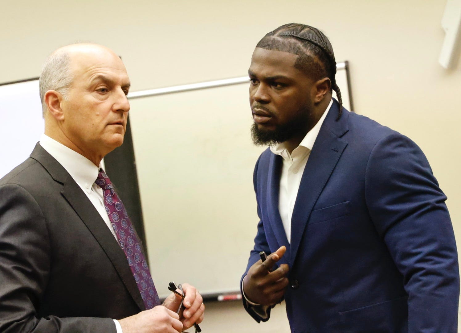 Jabrill Peppers confers with his lawyer, Marc Brofsky. Peppers will stand trial on Thursday, Jan. 23, 2025, on three counts of assaulting a woman in his Braintree apartment.