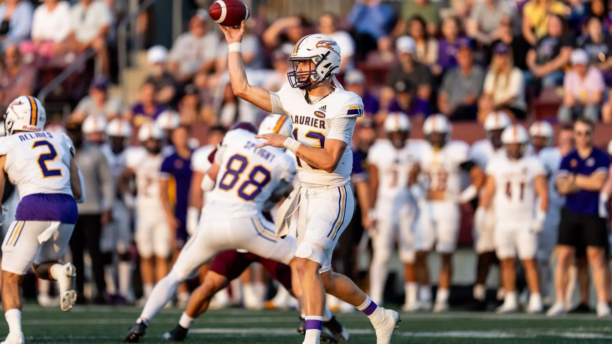 Laurier quarterback Taylor Elgersma (13) throws a pass to the left.