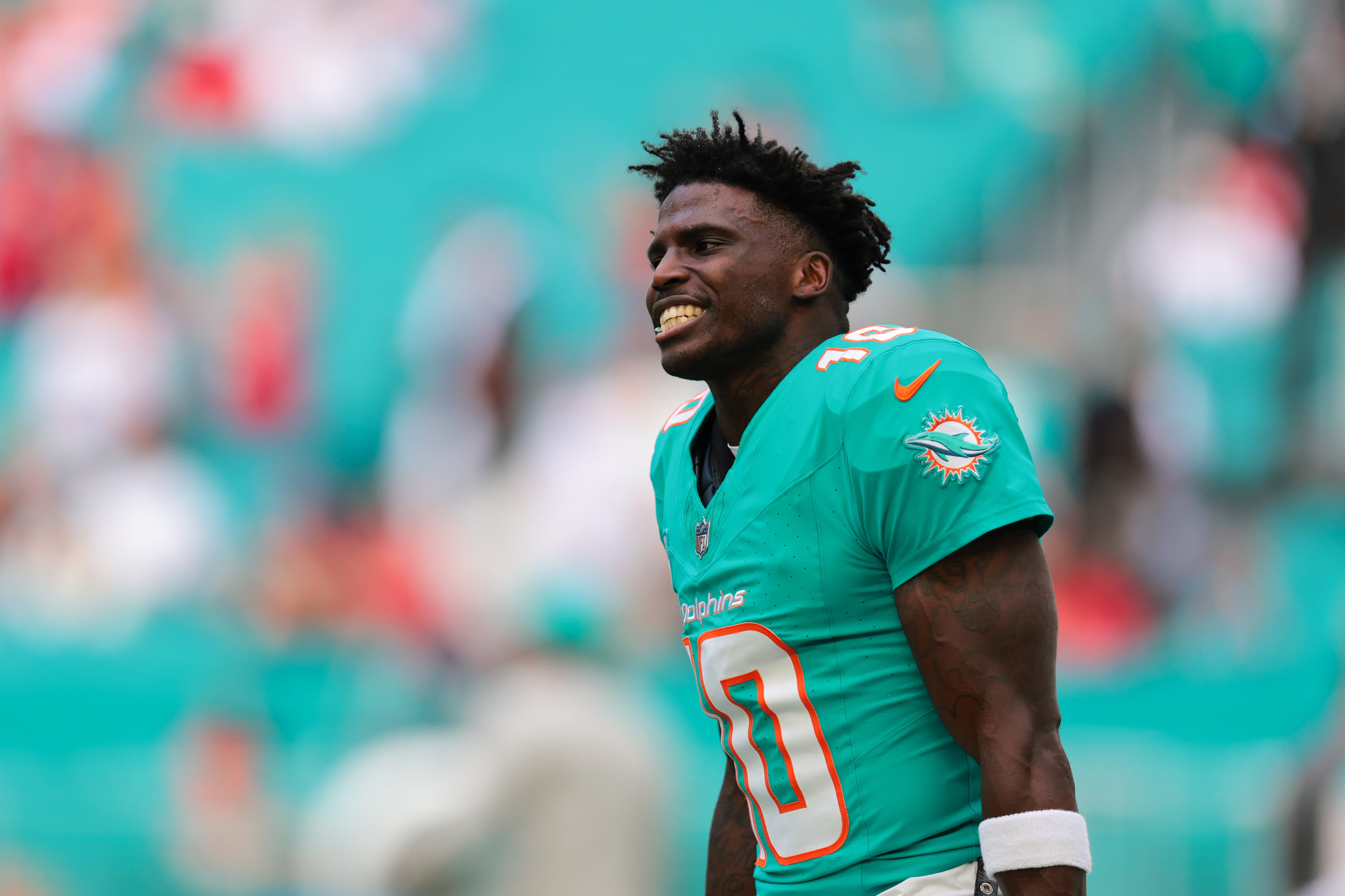 Dec 22, 2024; Miami Gardens, Florida, USA; Miami Dolphins wide receiver Tyreek Hill (10) reacts on the field before the game against the San Francisco 49ers at Hard Rock Stadium.