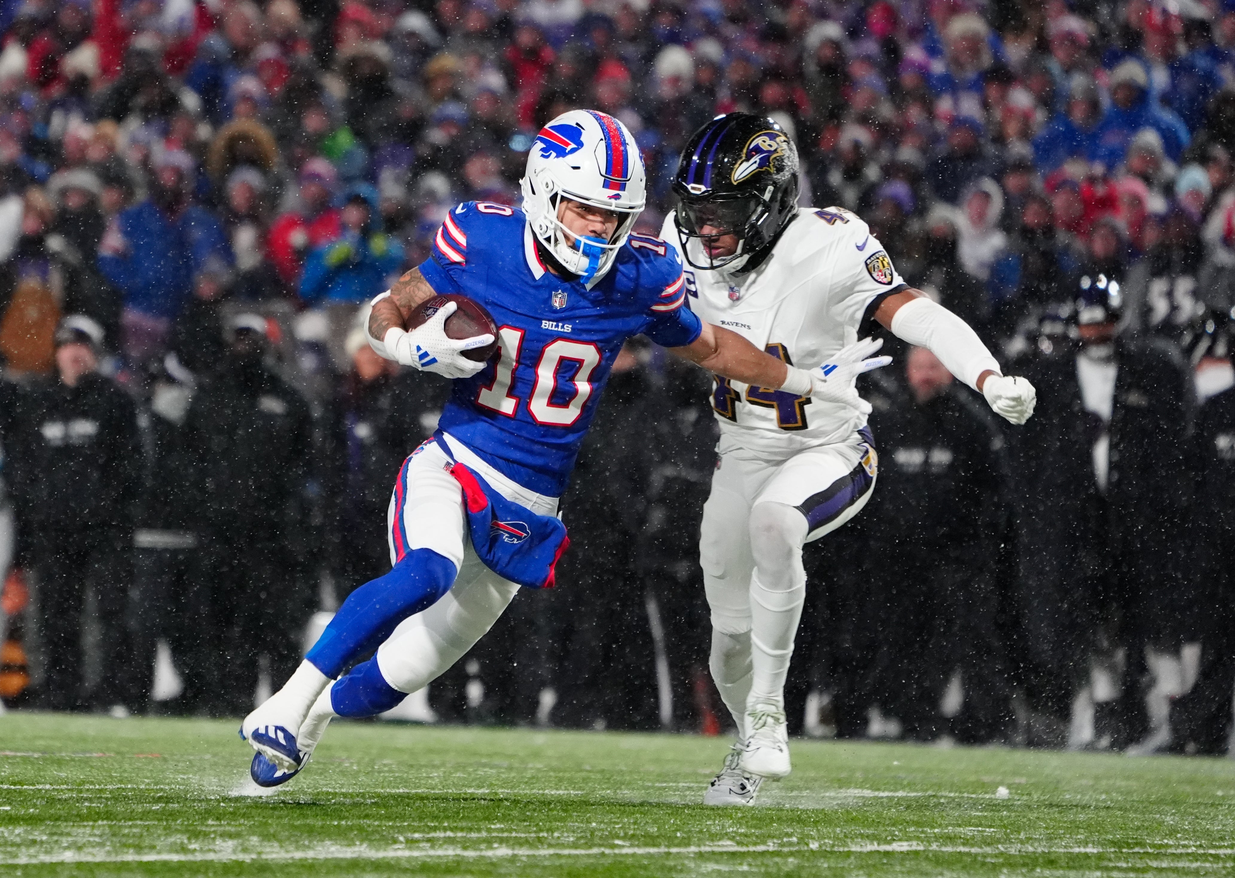 Buffalo Bills wide receiver Khalil Shakir (10) runs the ball against Baltimore Ravens cornerback Marlon Humphrey (44) during the second quarter in a 2025 AFC divisional round game at Highmark Stadium.
