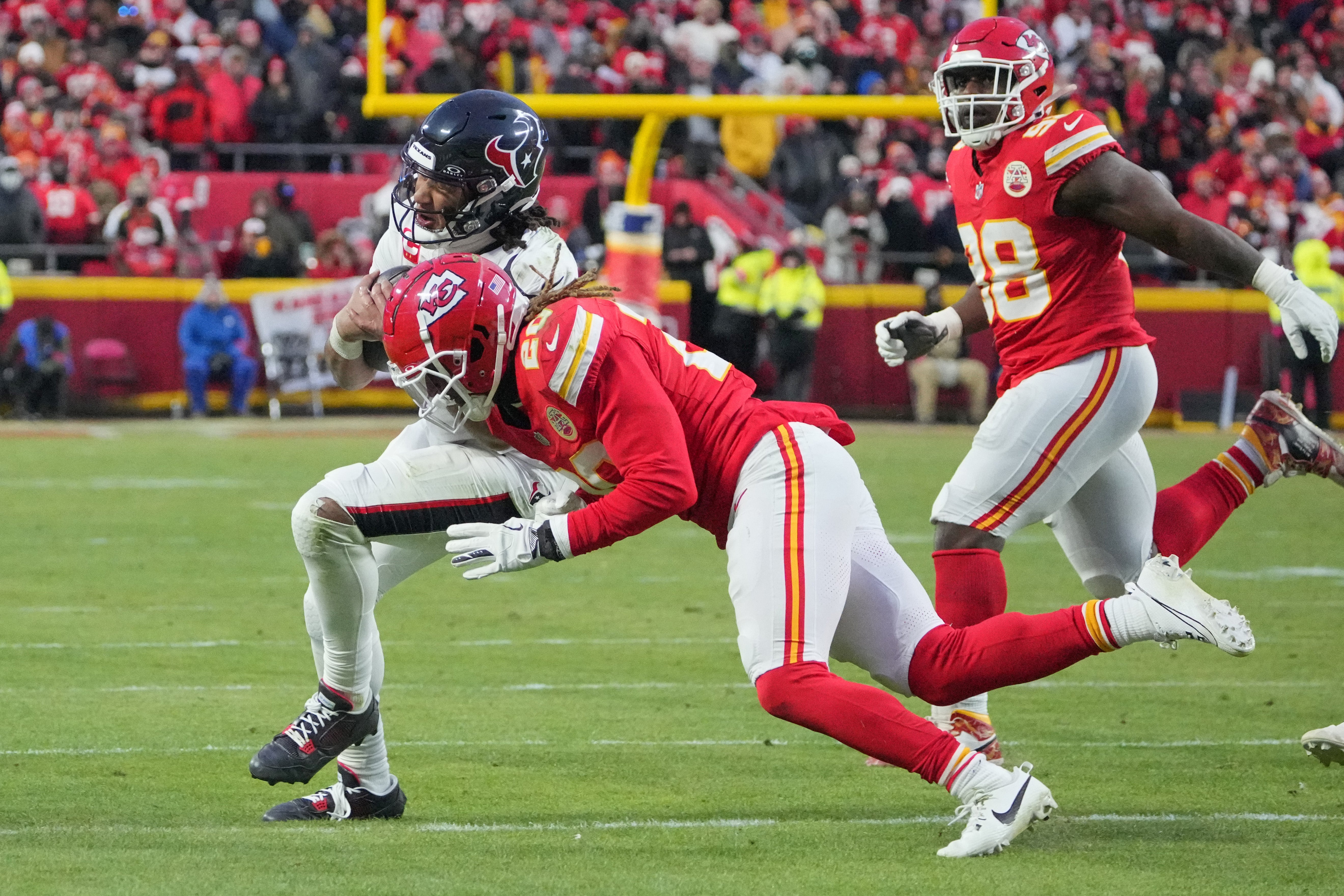 Texans quarterback C.J. Stroud (7) is tackled by Chiefs safety Justin Reid (20)