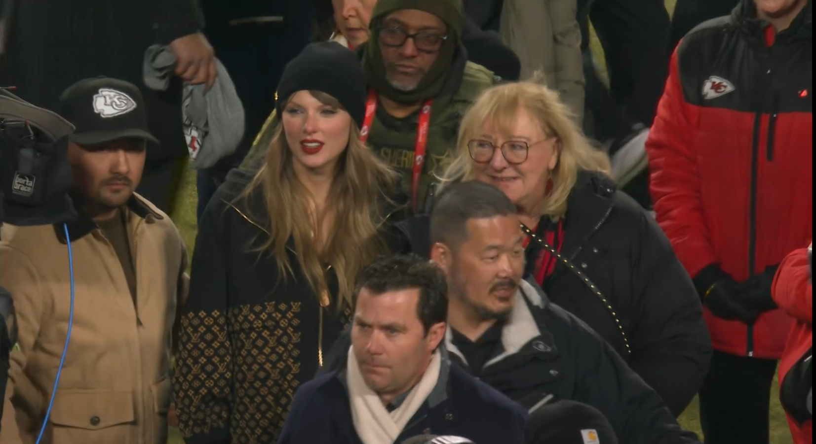 Taylor Swift and Donna Kelce on the field at Arrowhead Stadium after Chiefs' AFC Championship win over Bills