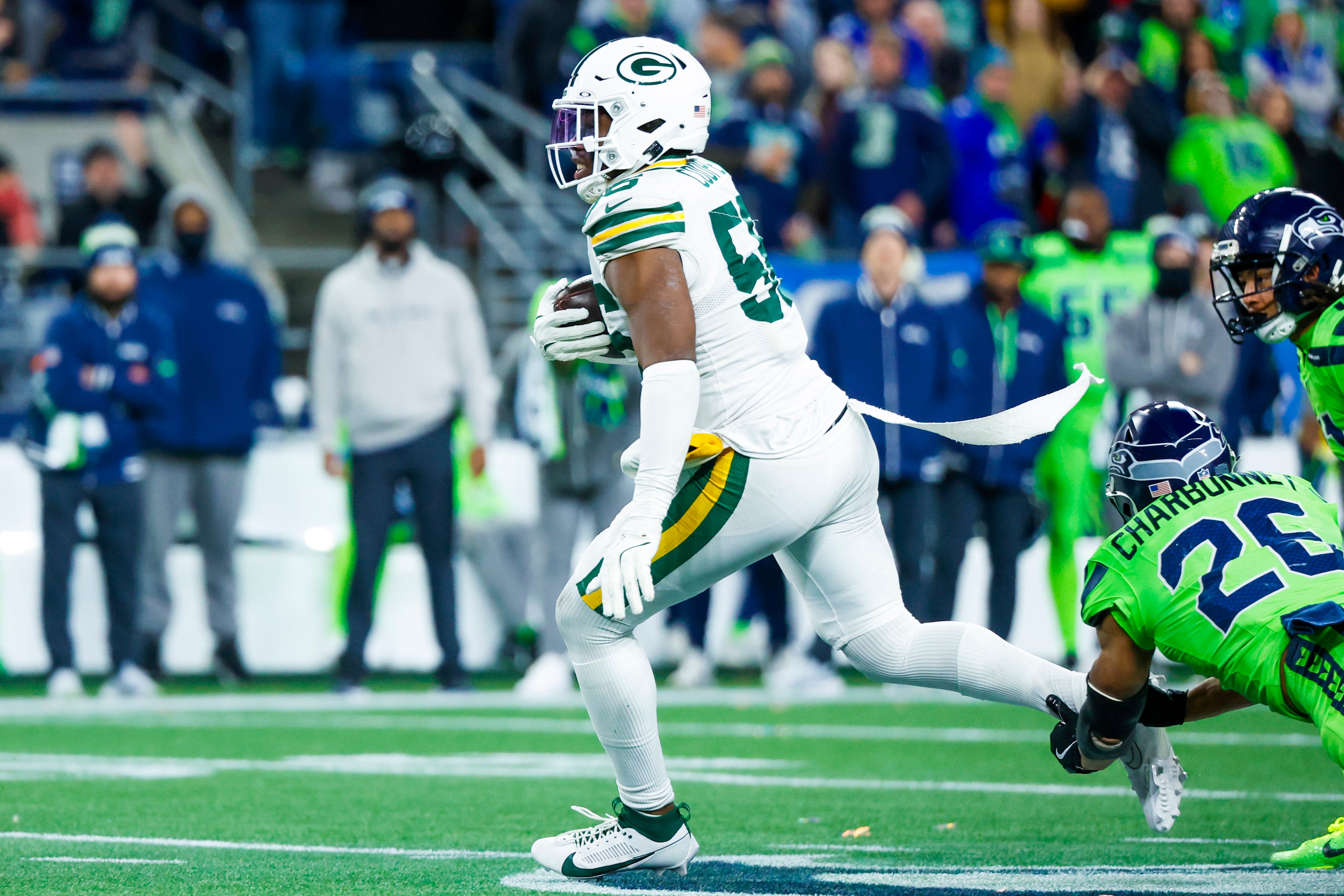Green Bay Packers linebacker Edgerrin Cooper (56) returns an interception against the Seattle Seahawks during the fourth quarter at Lumen Field.
