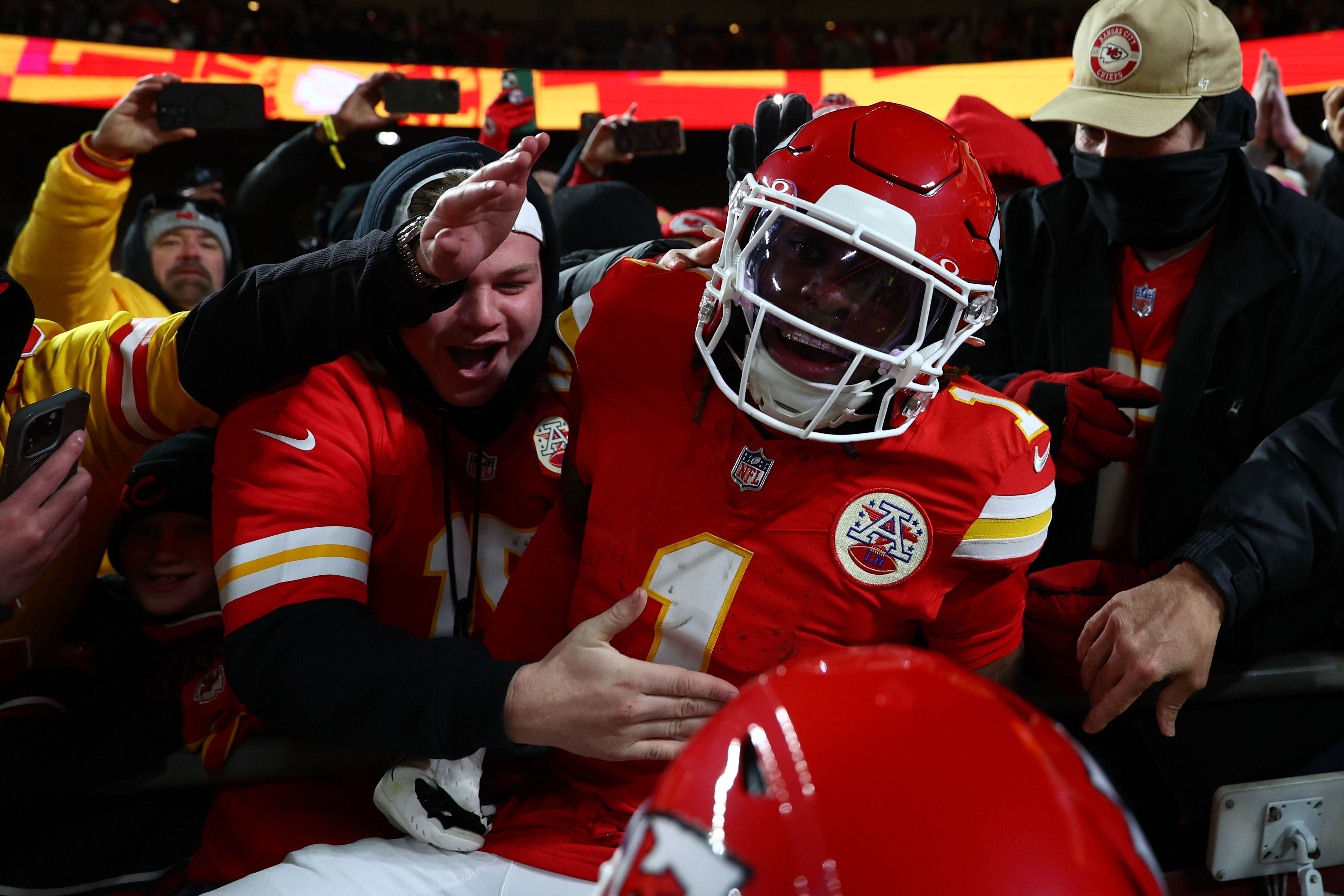 Jan 26, 2025; Kansas City, MO, USA; Kansas City Chiefs wide receiver Xavier Worthy (1) reacts with fans after a touchdown against the Buffalo Bills during the first half in the AFC Championship game at GEHA Field at Arrowhead Stadium.
