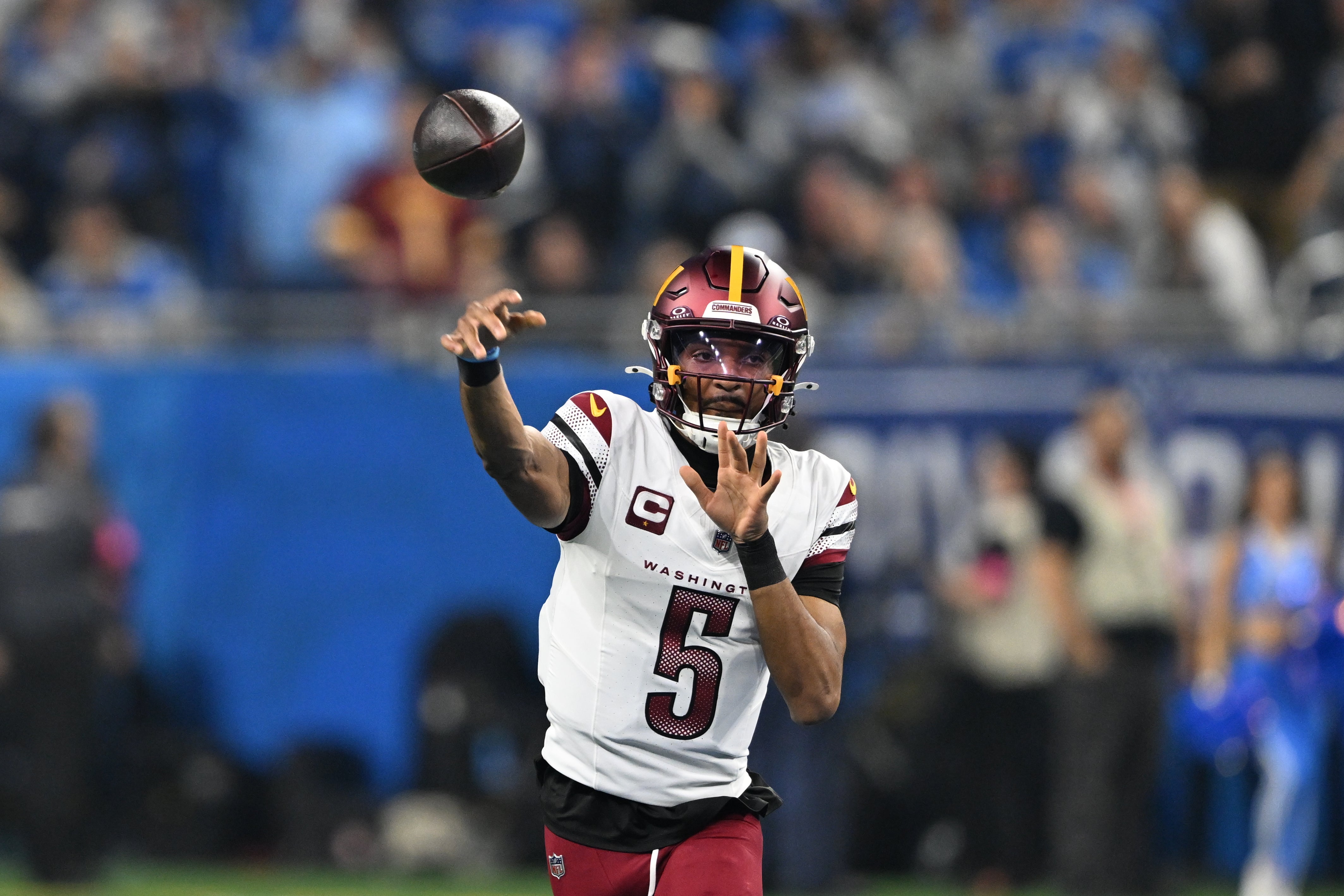 Jan 18, 2025; Detroit, Michigan, USA; Washington Commanders quarterback Jayden Daniels (5) throws a pass during the first quarter against Detroit Lions in a 2025 NFC divisional round game at Ford Field.