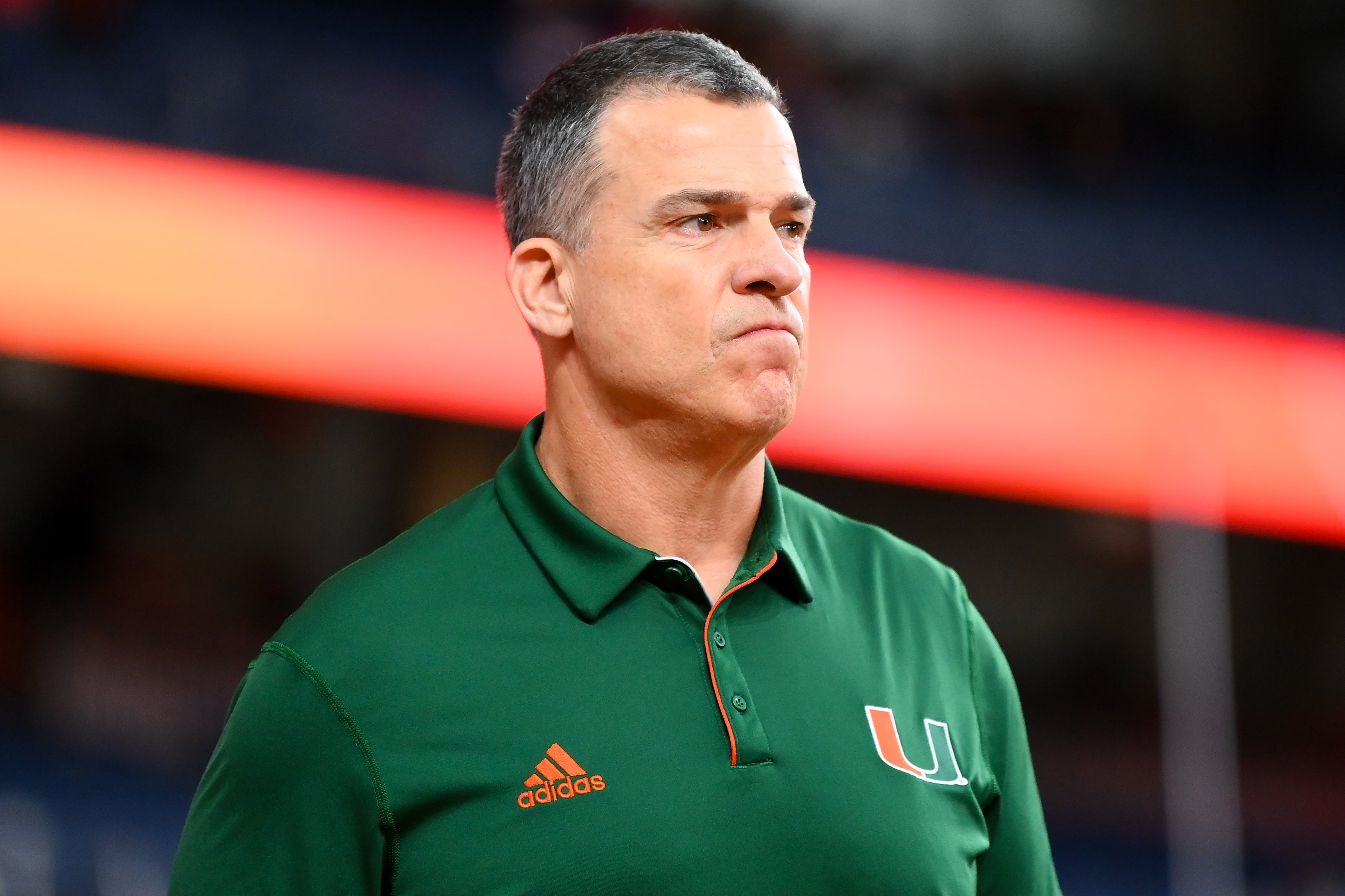 Nov 30, 2024; Syracuse, New York, USA; Miami Hurricanes head coach Mario Cristobal looks on prior to the game against the Syracuse Orange at the JMA Wireless Dome.