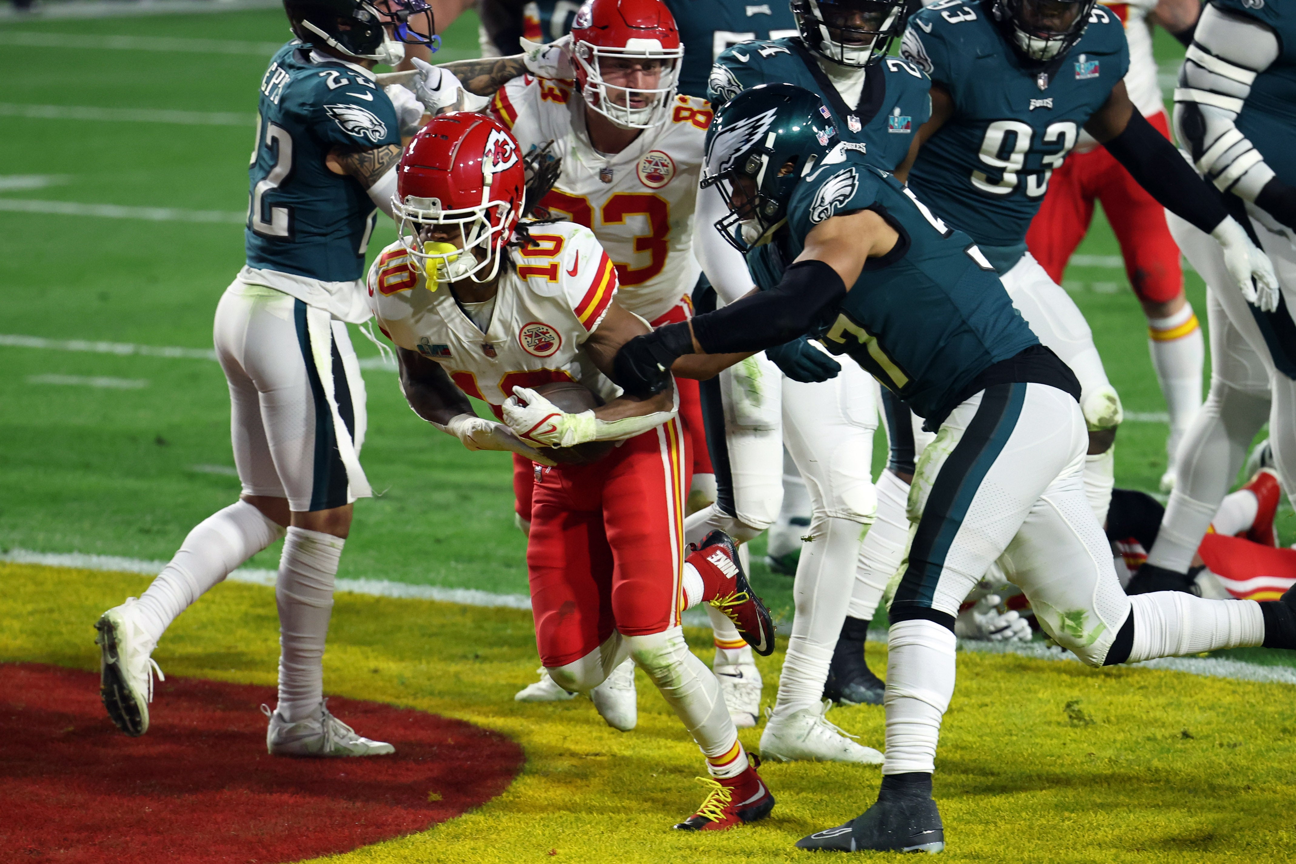 Feb 12, 2023; Glendale, Arizona, US; Kansas City Chiefs running back Isiah Pacheco (10) scores a touchdown against Philadelphia Eagles linebacker T.J. Edwards (57) in the third quarter of Super Bowl LVII at State Farm Stadium.
