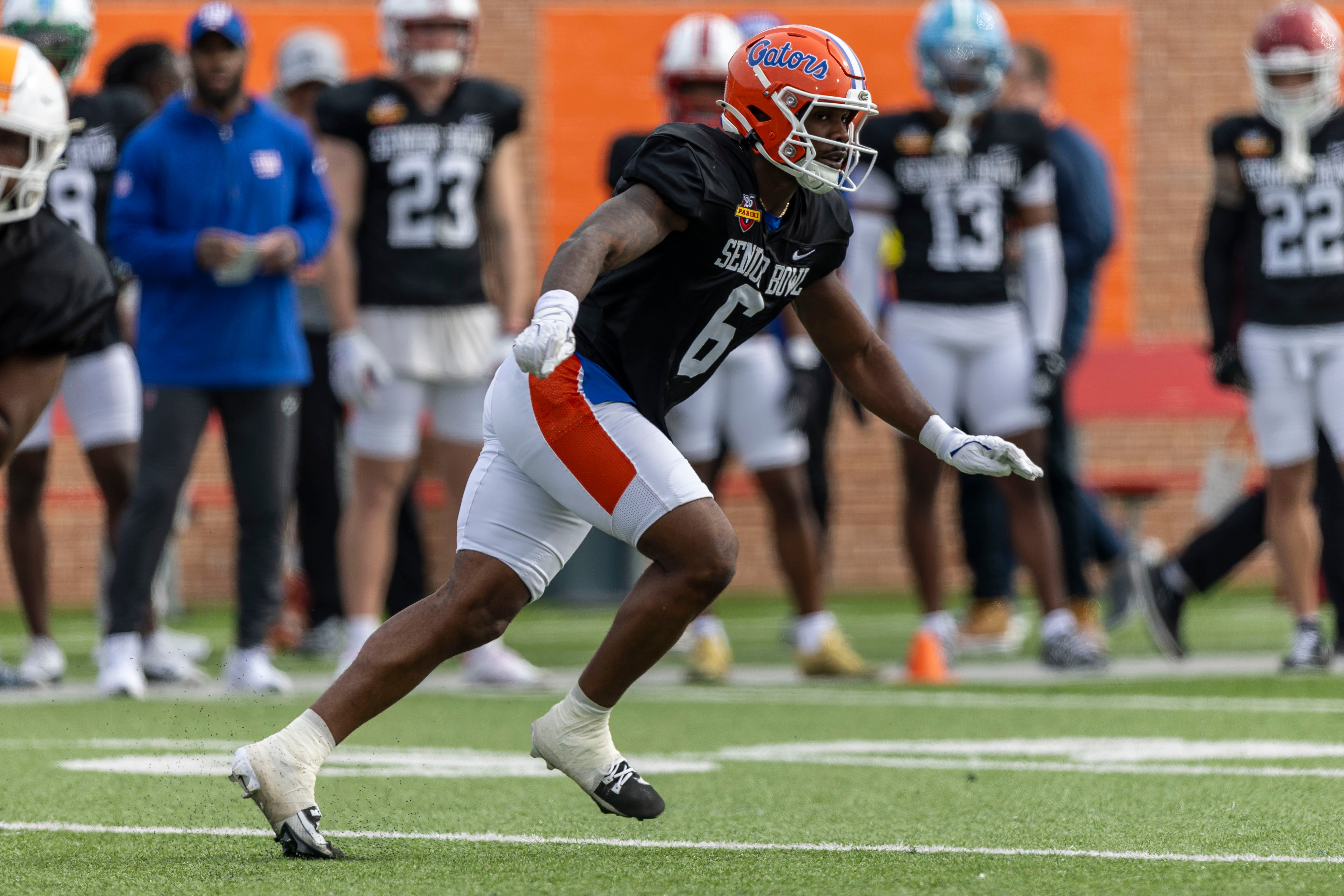 Jan 28, 2025; Mobile, AL, USA; American team linebacker Shemar James of Florida (6) works in passing drills during Senior Bowl practice for the American team at Hancock Whitney Stadium.
