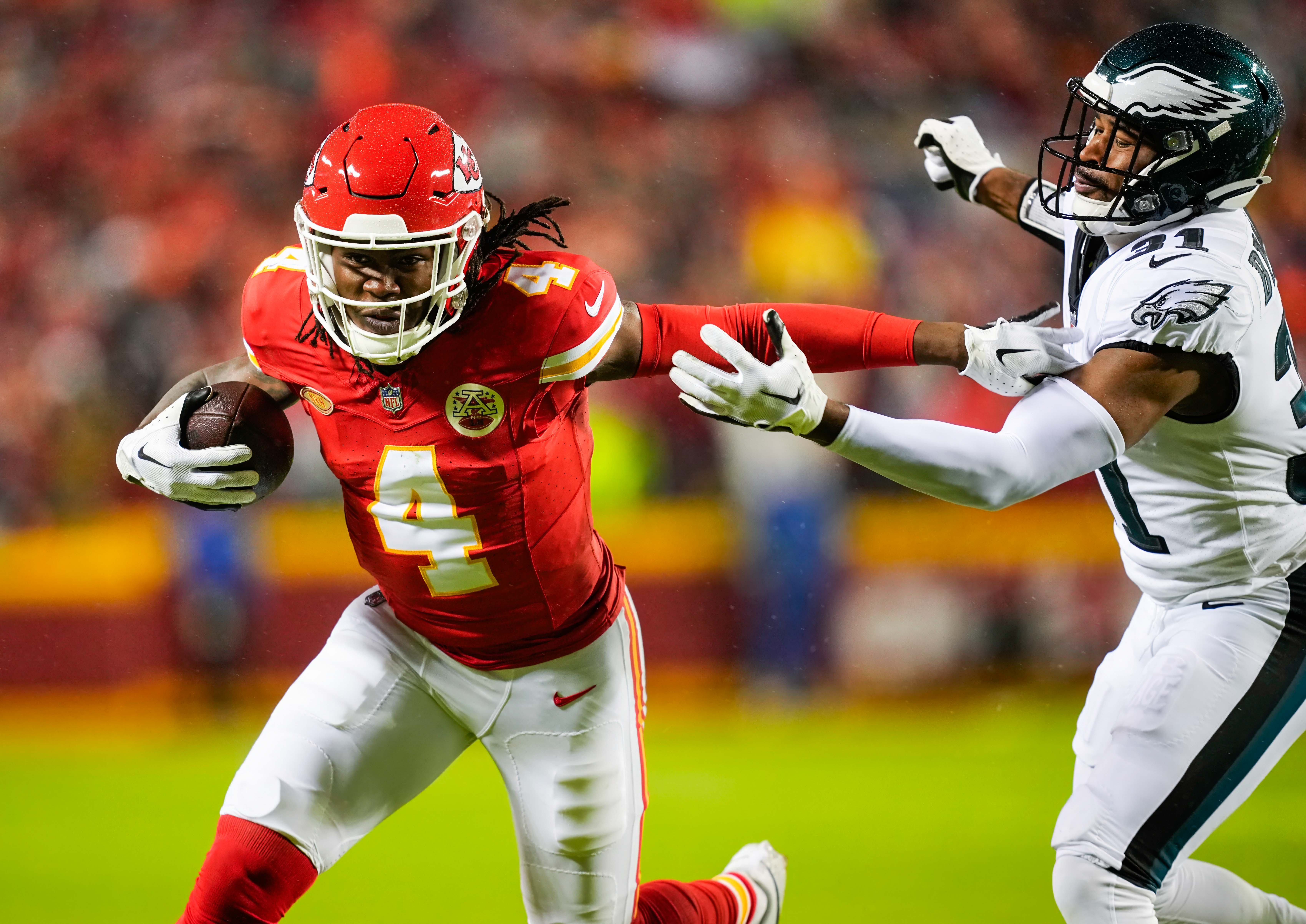 Nov 20, 2023; Kansas City, Missouri, USA; Kansas City Chiefs wide receiver Rashee Rice (4) runs with the ball against Philadelphia Eagles safety Kevin Byard (31) during the first half at GEHA Field at Arrowhead Stadium.