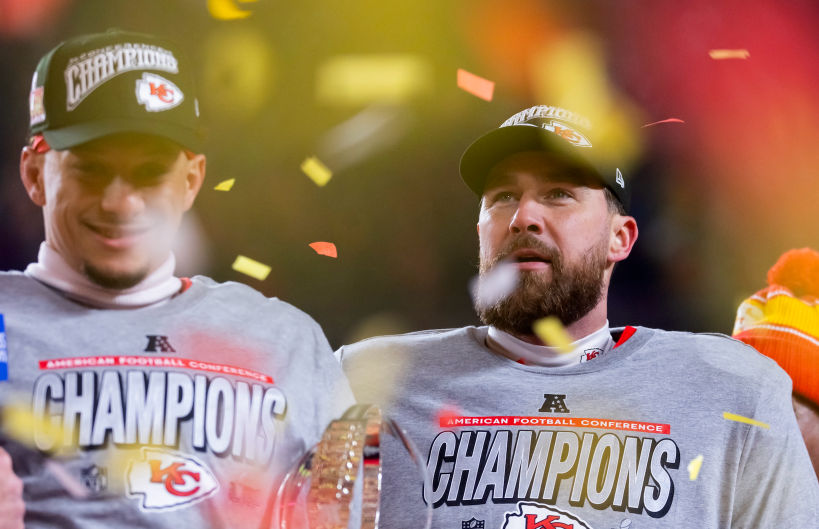 Jan 26, 2025; Kansas City, MO, USA; Confetti falls as Kansas City Chiefs tight end Travis Kelce (right) celebrates with quarterback Patrick Mahomes after defeating the Buffalo Bills during the AFC Championship game at GEHA Field at Arrowhead Stadium.