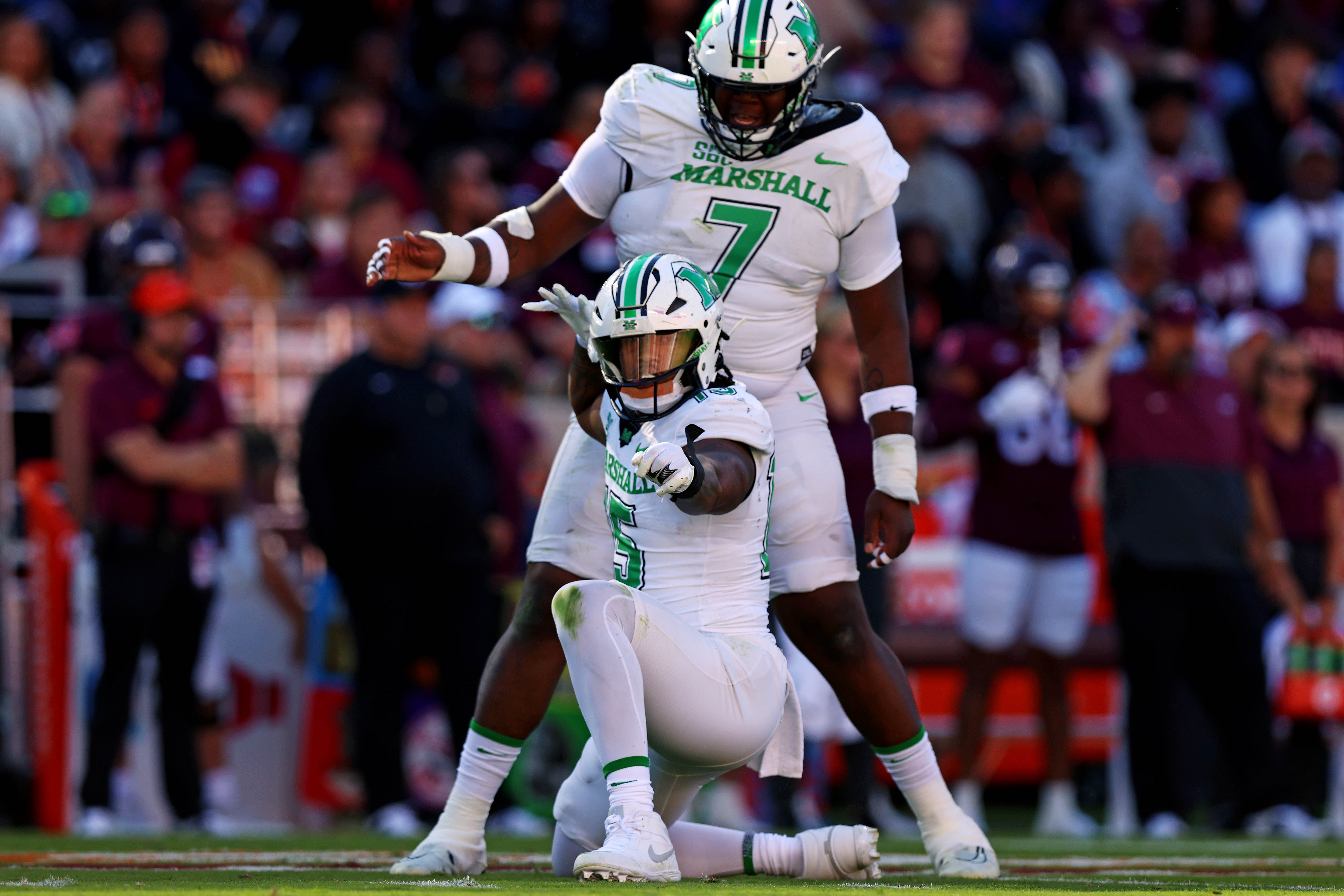 Sep 7, 2024; Blacksburg, Virginia, USA; Marshall Thundering Herd defensive lineman Mike Green (15) celebrates after sacking Virginia Tech Hokies quarterback Kyron Drones (1) during the first quarter at Lane Stadium.