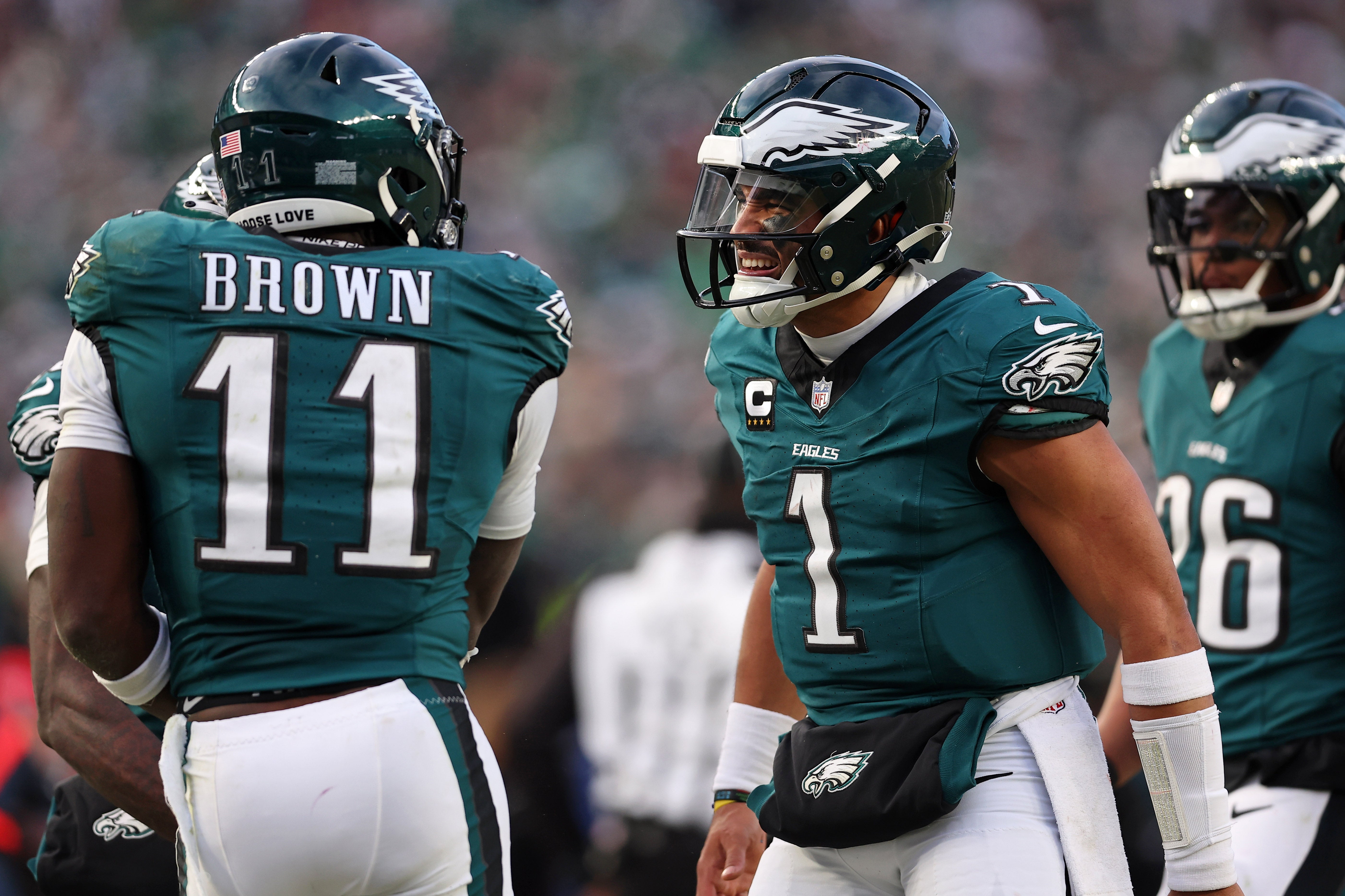 Philadelphia Eagles quarterback Jalen Hurts (1) and wide receiver A.J. Brown (11) celebrate after a touchdown against the Washington Commanders during the first half in the NFC Championship.