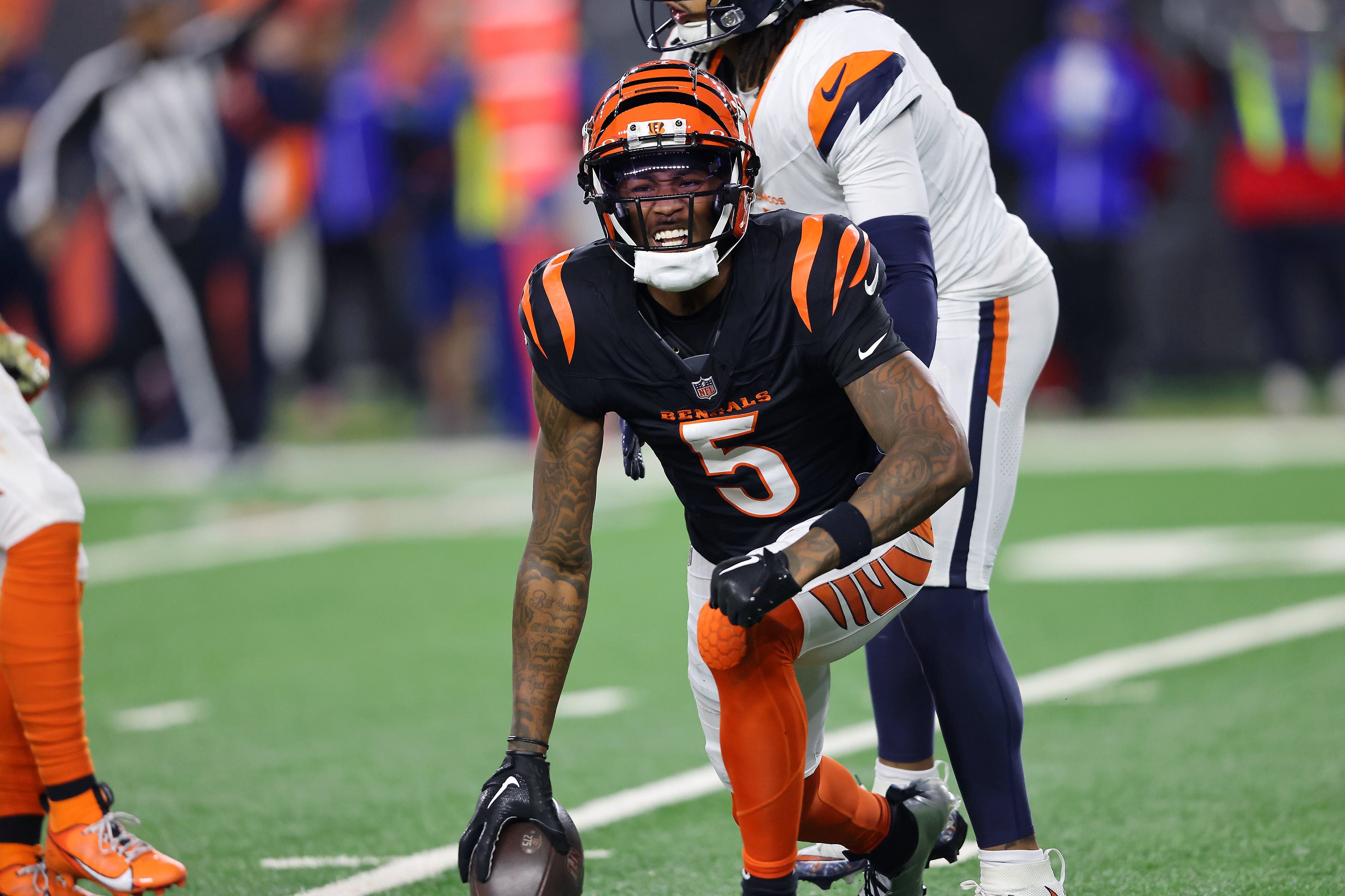 Dec 28, 2024; Cincinnati, Ohio, USA; Cincinnati Bengals wide receiver Tee Higgins (5) reacts after catching a first down pass in overtime against the Denver Broncos at Paycor Stadium.