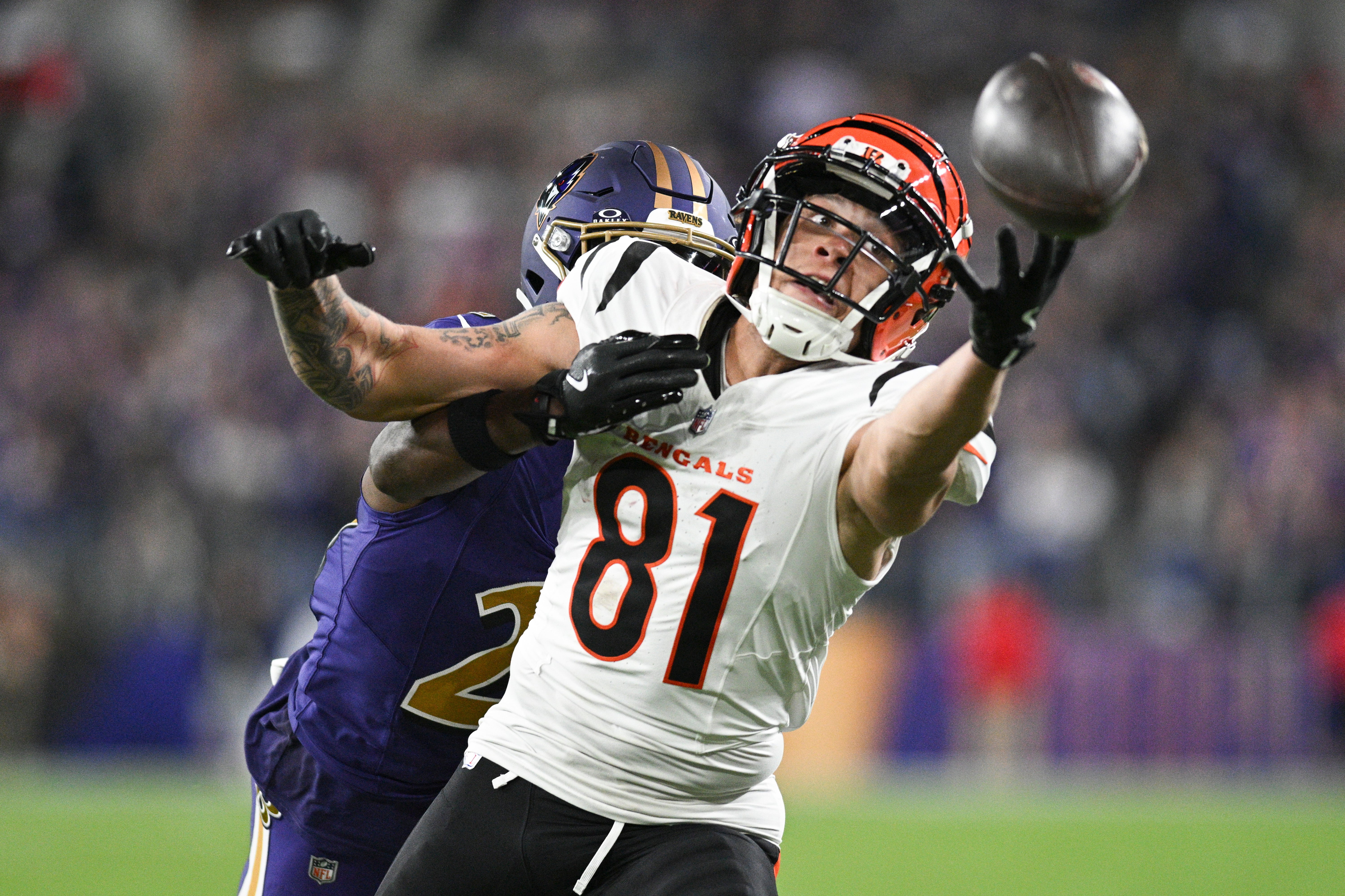 Nov 7, 2024; Baltimore, Maryland, USA; Cincinnati Bengals wide receiver Jermaine Burton (81) reaches for quarterback Joe Burrow (not pictured) throws ass Baltimore Ravens cornerback Brandon Stephens (21) defends during the second half at M&T Bank Stadium.