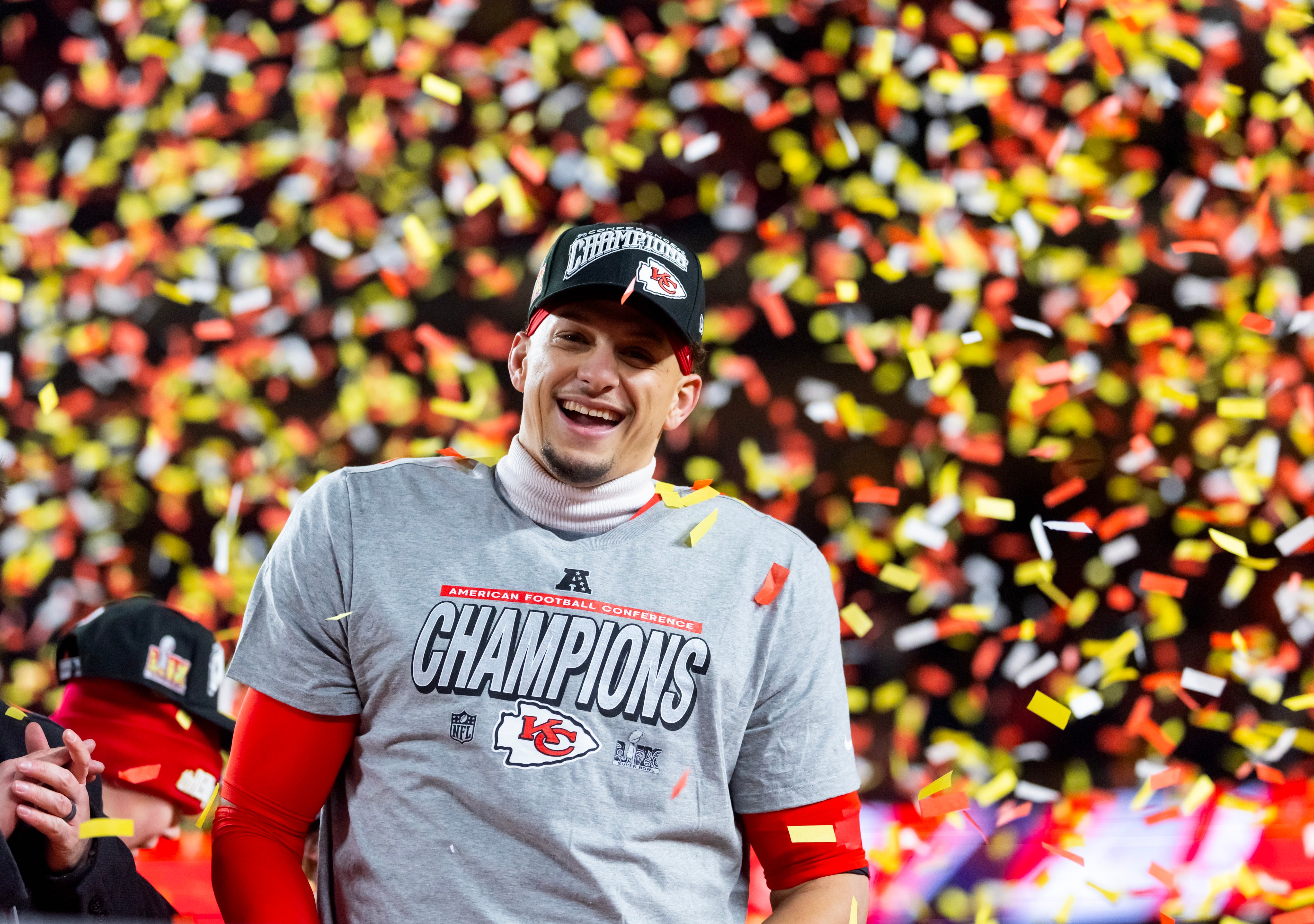 Jan 26, 2025; Kansas City, MO, USA; Confetti falls as Kansas City Chiefs quarterback Patrick Mahomes celebrates after defeating the Buffalo Bills during the AFC Championship game at GEHA Field at Arrowhead Stadium.