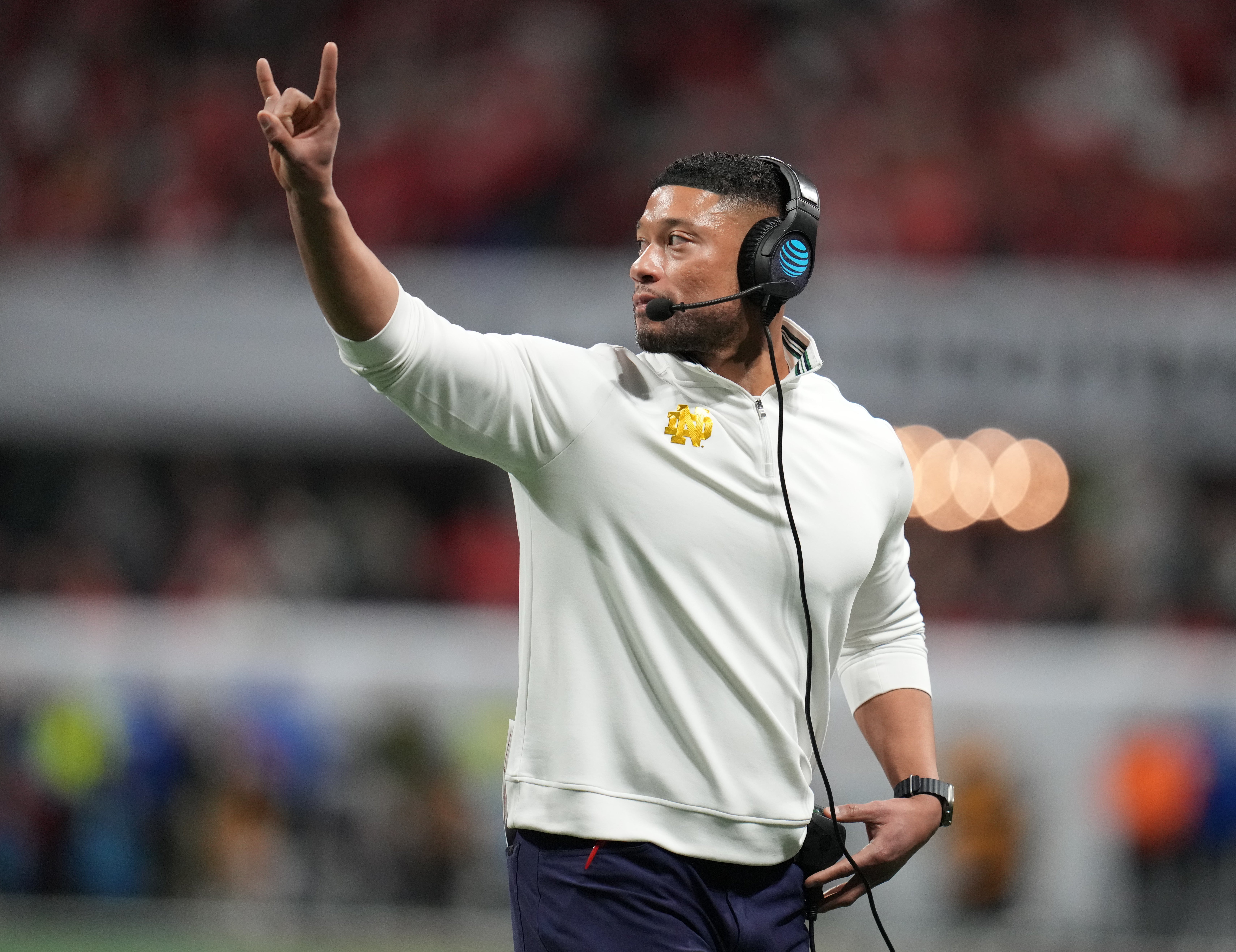 Notre Dame Fighting Irish head coach Marcus Freeman reacts against the Ohio State Buckeyes in the second half in the CFP National Championship college football game at Mercedes-Benz Stadium.