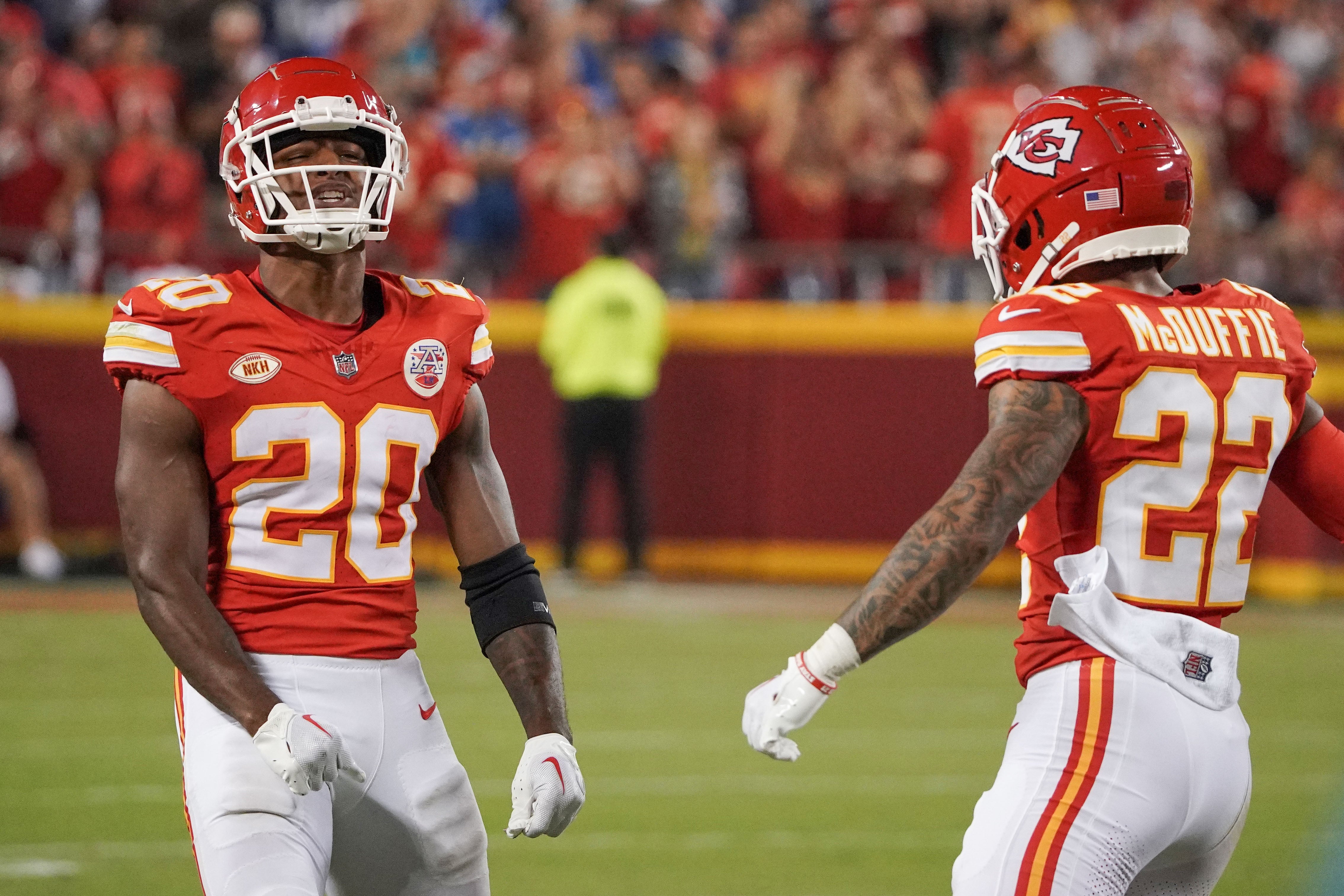 Chiefs safety Justin Reid (20) celebrates with cornerback Trent McDuffie (22) after a play against the Lions during the game at GEHA Field at Arrowhead Stadium.
