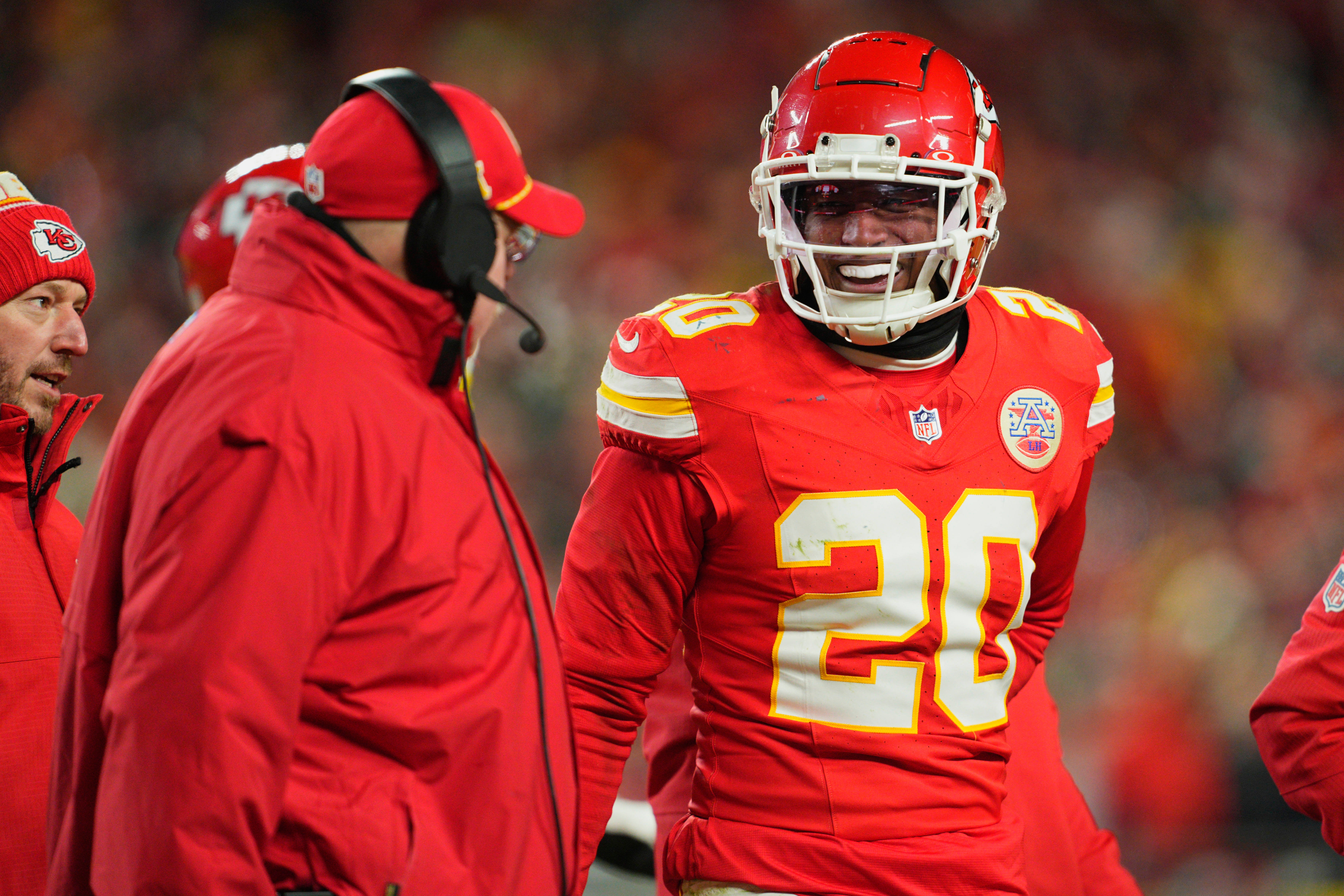 Chiefs head coach Andy Reid (left) talks with safety Justin Reid (20) during the fourth quarter of a 2025 AFC divisional round game against the Texans.