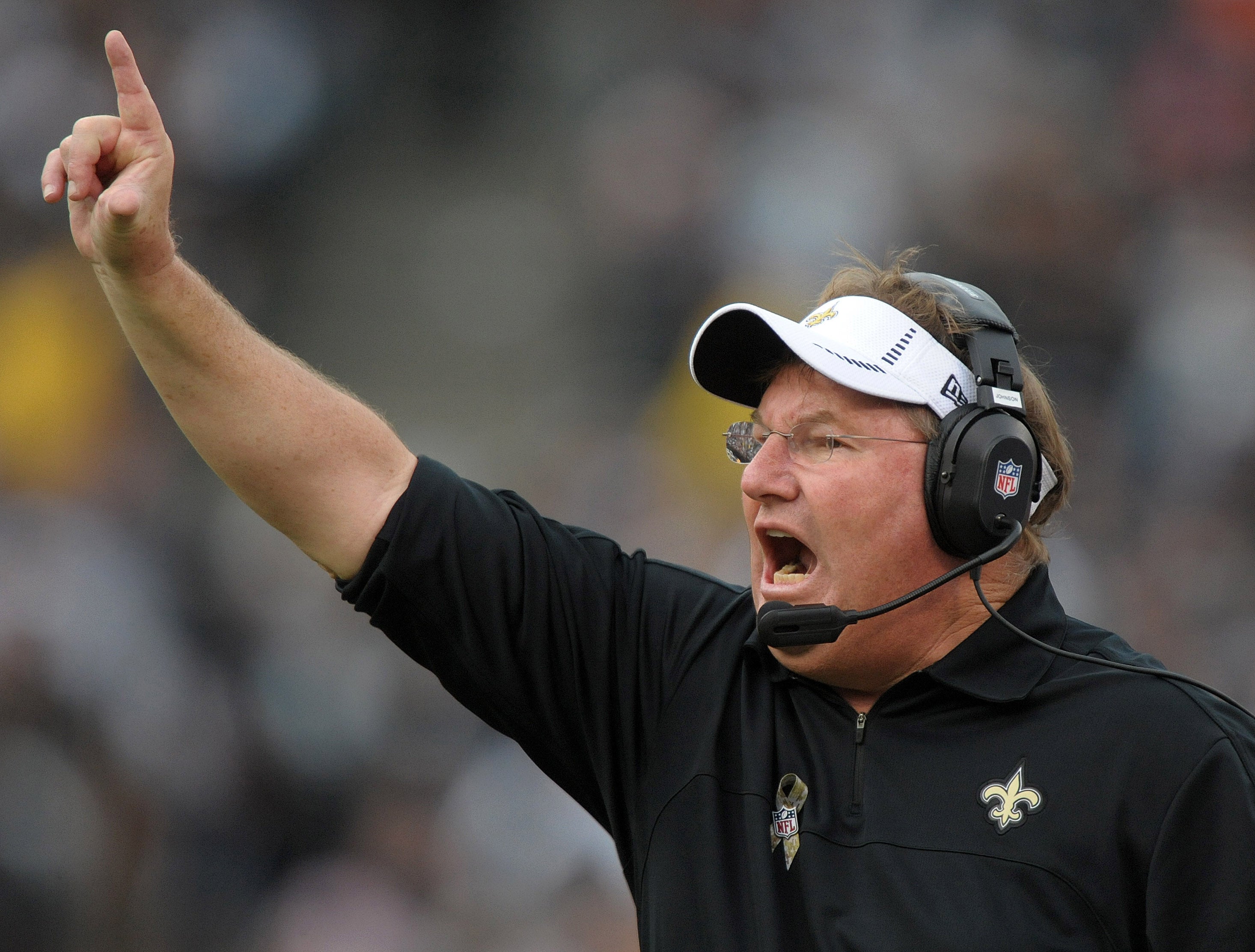 Nov 18, 2012; Oakland, CA, USA; New Orleans Saints defensive line coach Bill Johnson reacts during the game against the Oakland Raiders at the O.co Coliseum. The Saints defeated the Raiders 38-17.