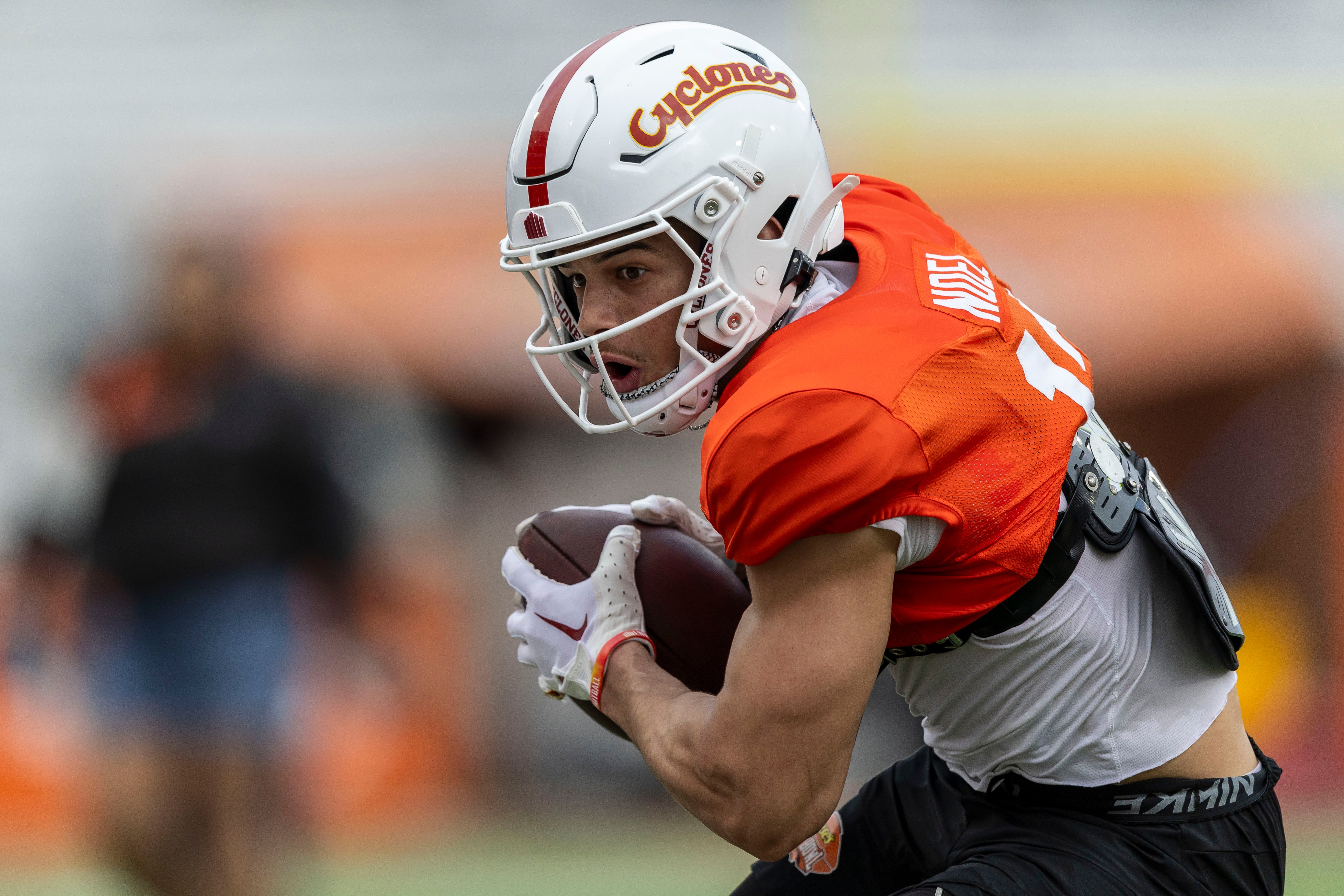 Jan 30, 2025; Mobile, AL, USA; National team wide receiver Jaylin Noel of Iowa State (12) works through drills during Senior Bowl practice for the National team at Hancock Whitney Stadium.