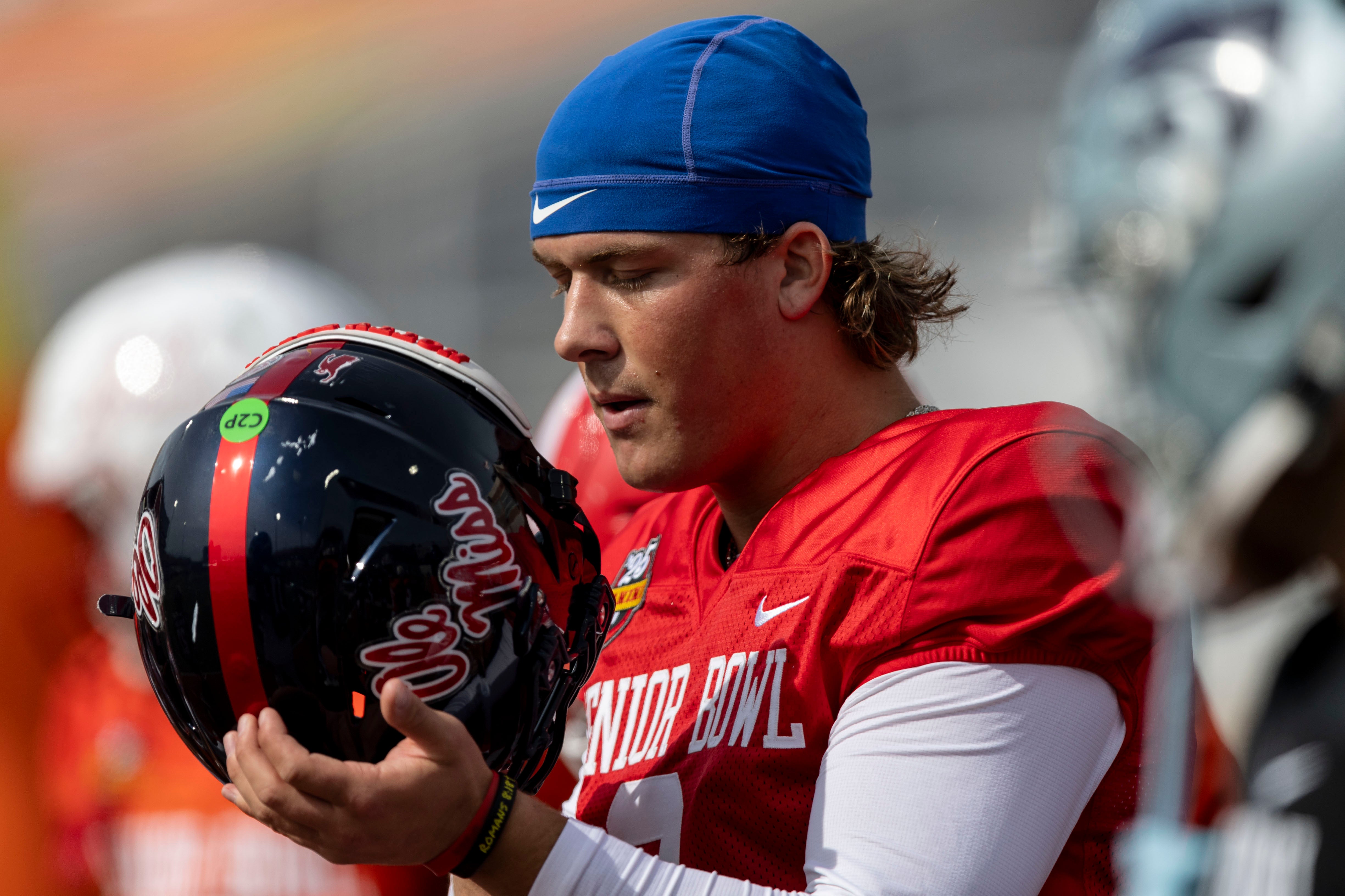 American team quarterback Jaxson Dart of Ole Miss (2) dons his helmet during Senior Bowl practice for the American team at Hancock Whitney Stadium. Vasha Hunt-Imagn Images