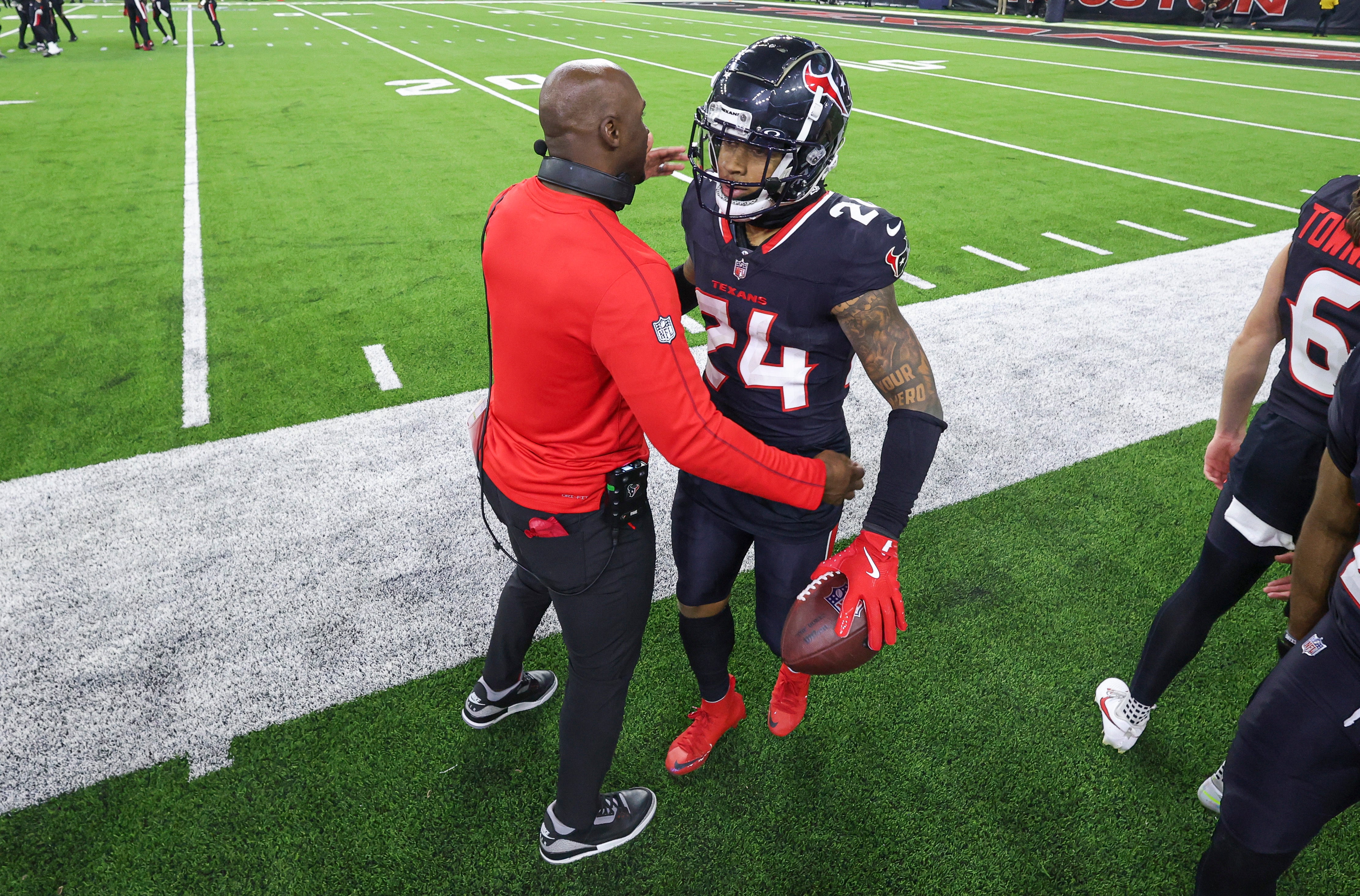 Jan 11, 2025; Houston, Texas, USA; Houston Texans head coach DeMeco Ryans embraces cornerback Derek Stingley Jr. (24) after a Stingley interception during the game against the Los Angeles Chargers in an AFC wild card game at NRG Stadium.