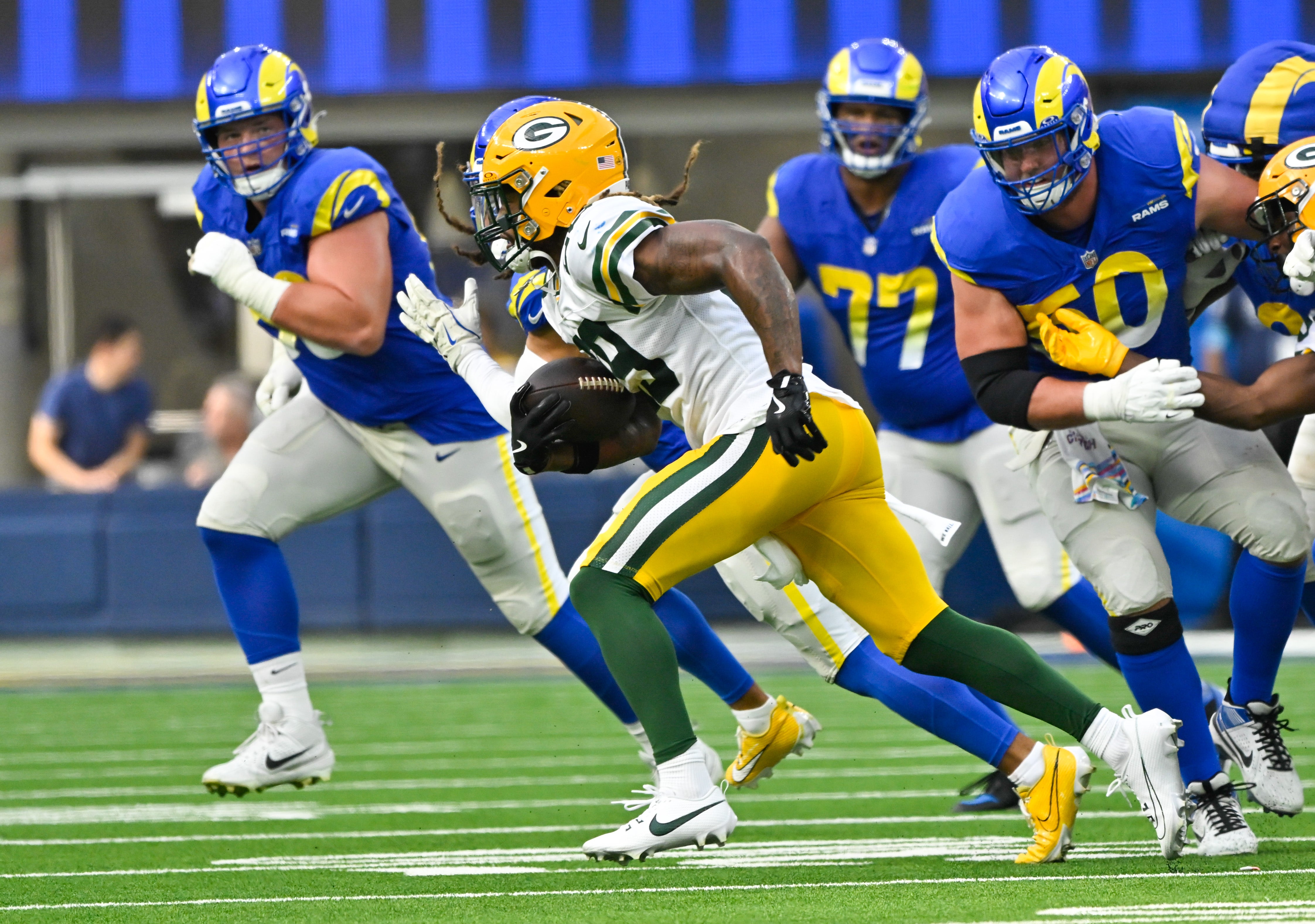 Green Bay Packers safety Xavier McKinney (29) runs down the field after intercepting a pass during the third quarter against the Los Angeles Rams at SoFi Stadium.