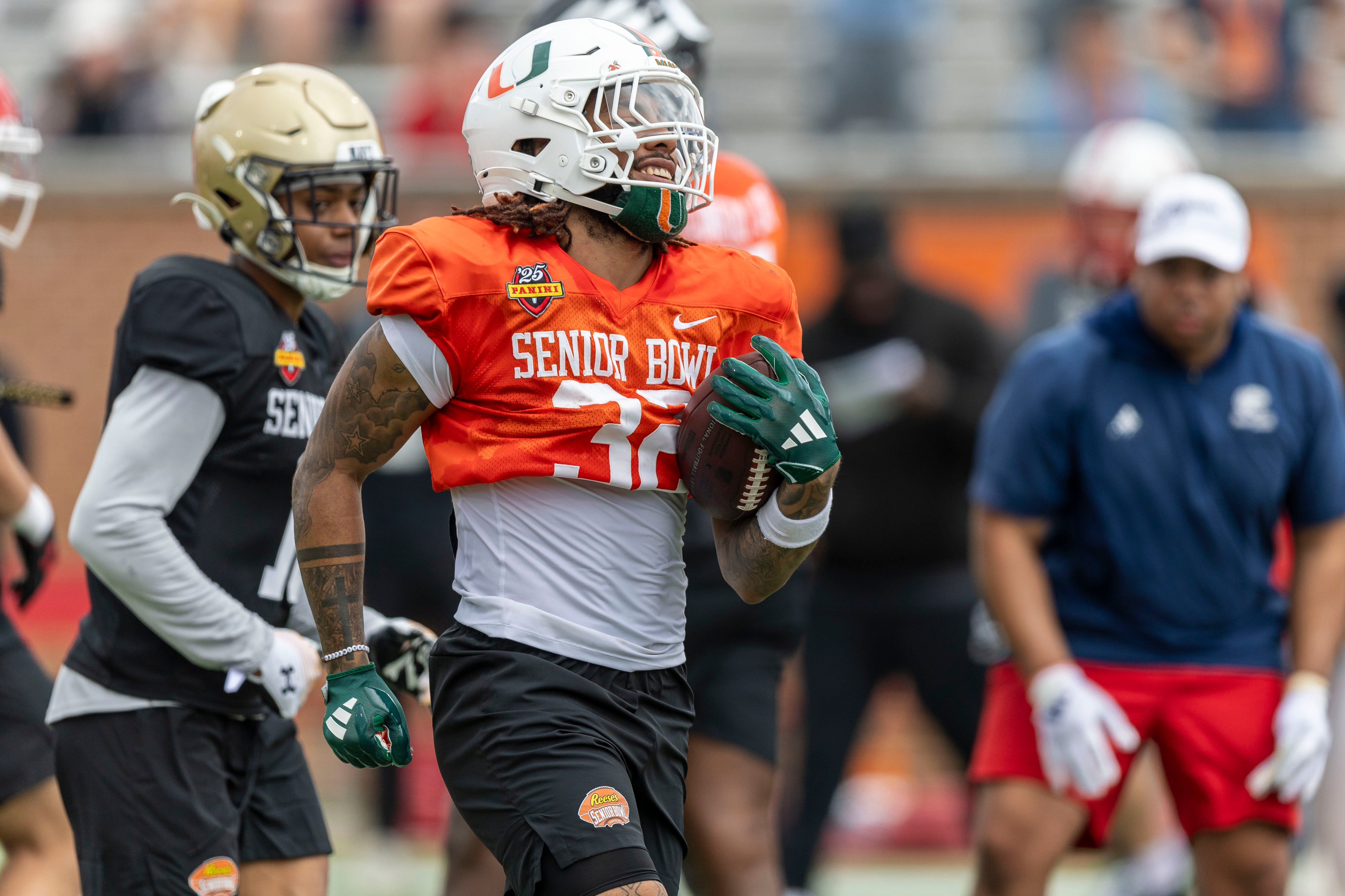 Jan 30, 2025; Mobile, AL, USA; National team running back Damien Martinez of Miami (32) works through drills during Senior Bowl practice for the National team at Hancock Whitney Stadium.