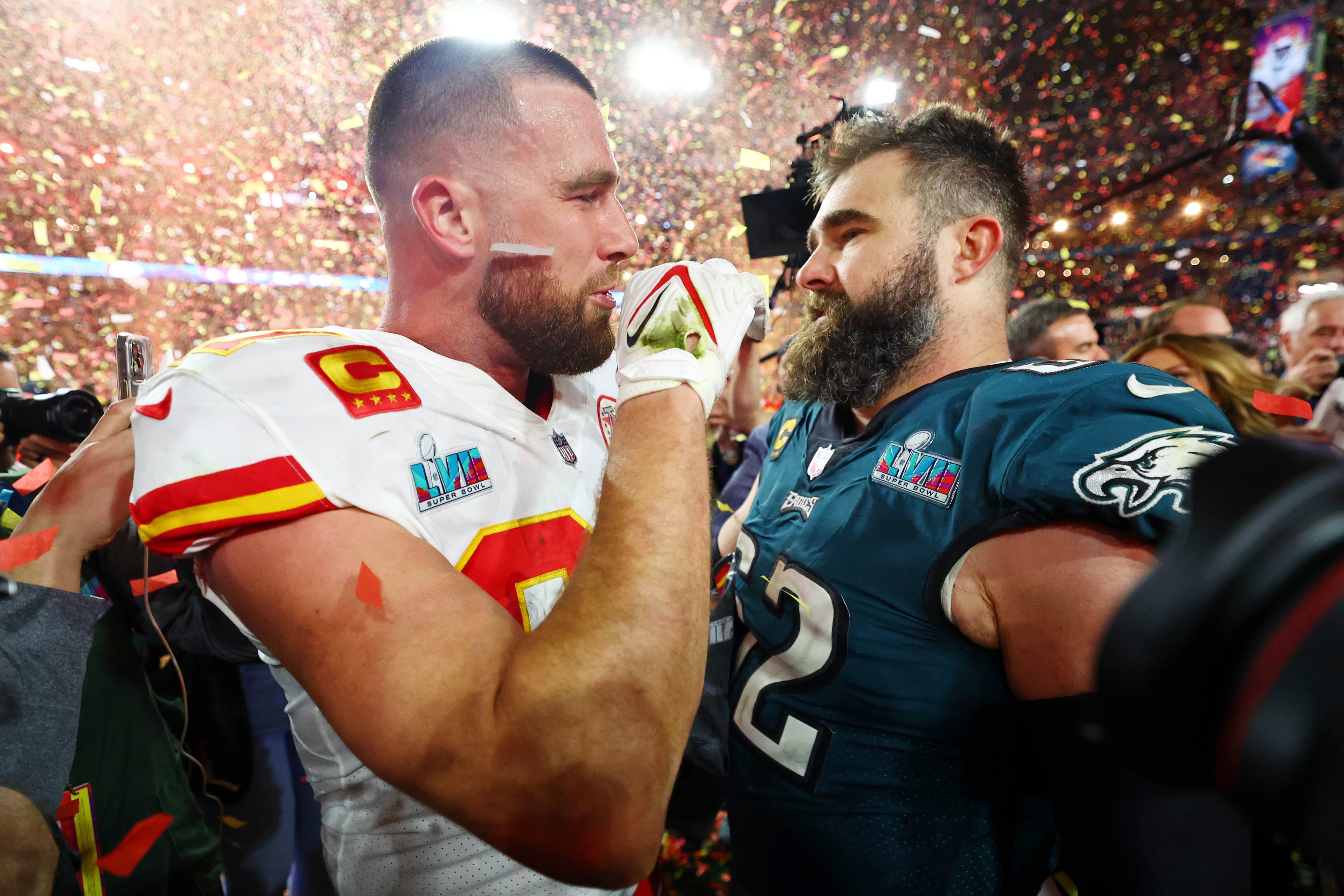 Feb 12, 2023; Glendale, Arizona, US; Kansas City Chiefs tight end Travis Kelce (87) talks with his brother Philadelphia Eagles center Jason Kelce (62) after he won Super Bowl LVII at State Farm Stadium.
