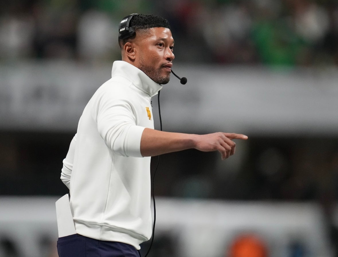 Jan 20, 2025; Atlanta, GA, USA; Notre Dame Fighting Irish head coach Marcus Freeman reacts against the Ohio State Buckeyes in the second half in the CFP National Championship college football game at Mercedes-Benz Stadium.