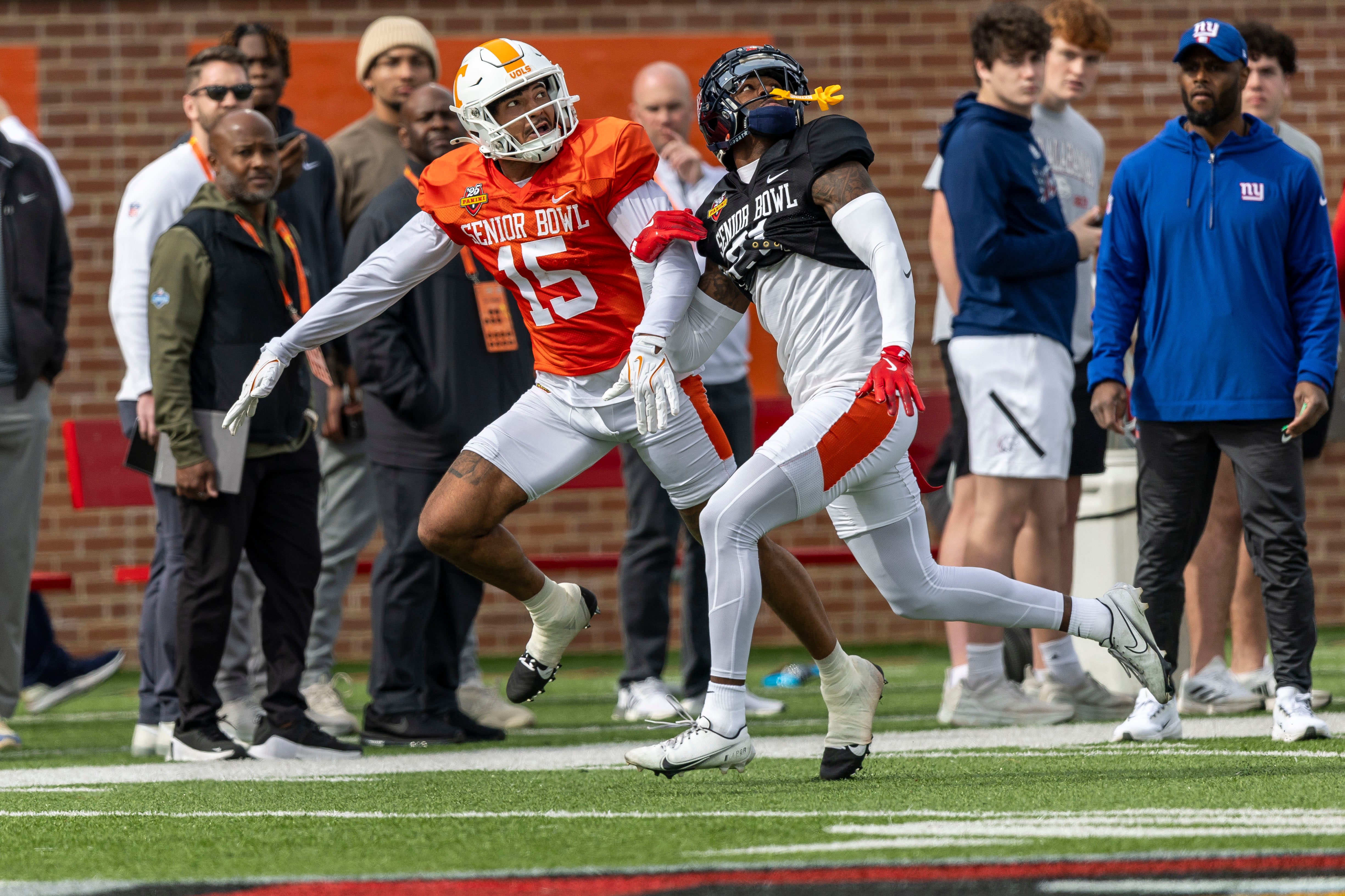 Jan 28, 2025; Mobile, AL, USA; American team wide receiver Bru McCoy III of Tennessee (15) battles with American team defensive back Trey Amos of Ole Miss (21) during Senior Bowl practice for the American team at Hancock Whitney Stadium.