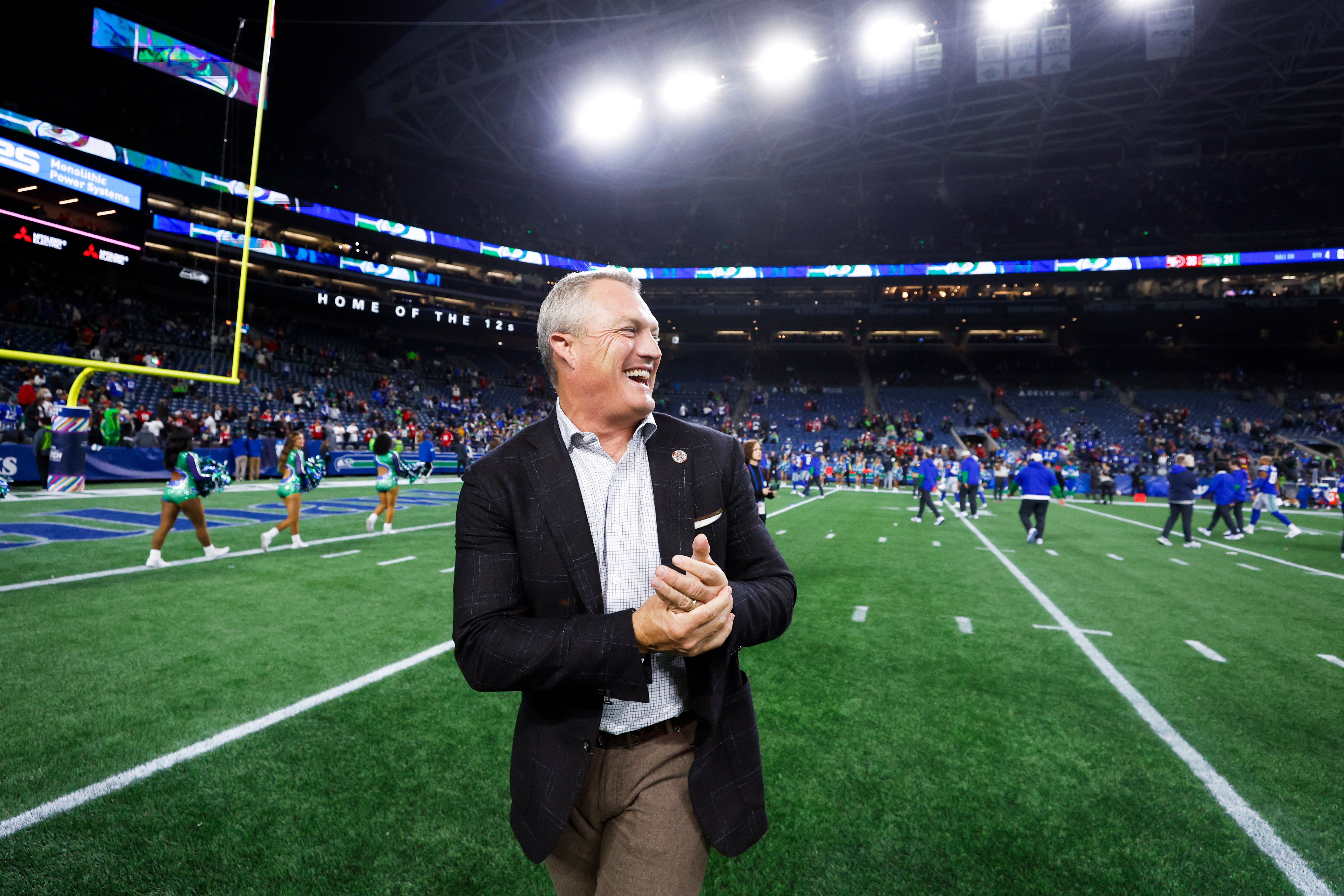 San Francisco 49ers general manager John Lynch celebrates following a victory against the Seattle Seahawks at Lumen Field.