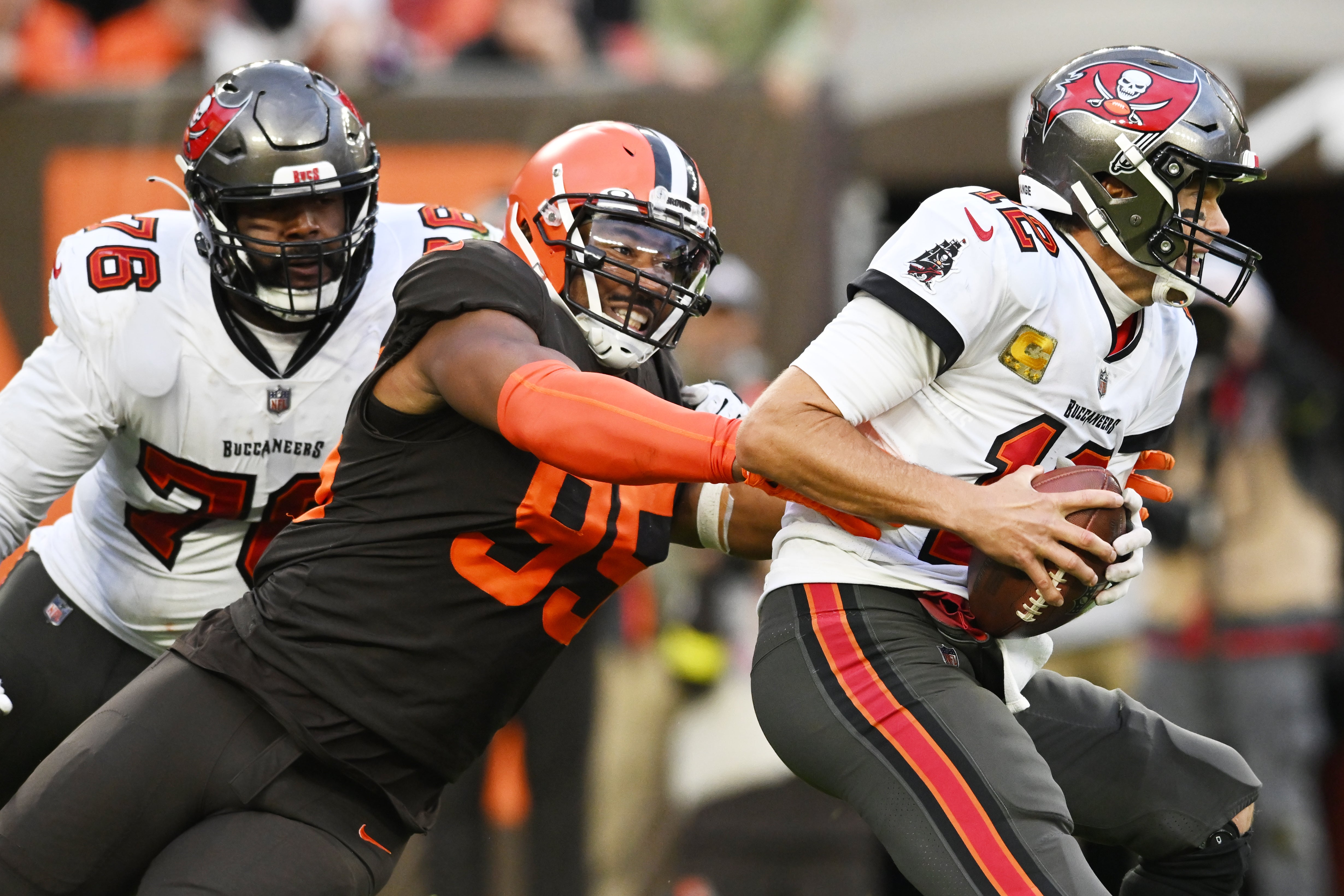 Nov 27, 2022; Cleveland, Ohio, USA; Cleveland Browns defensive end Myles Garrett (95) sacks Tampa Bay Buccaneers quarterback Tom Brady (12) during the second half at FirstEnergy Stadium.