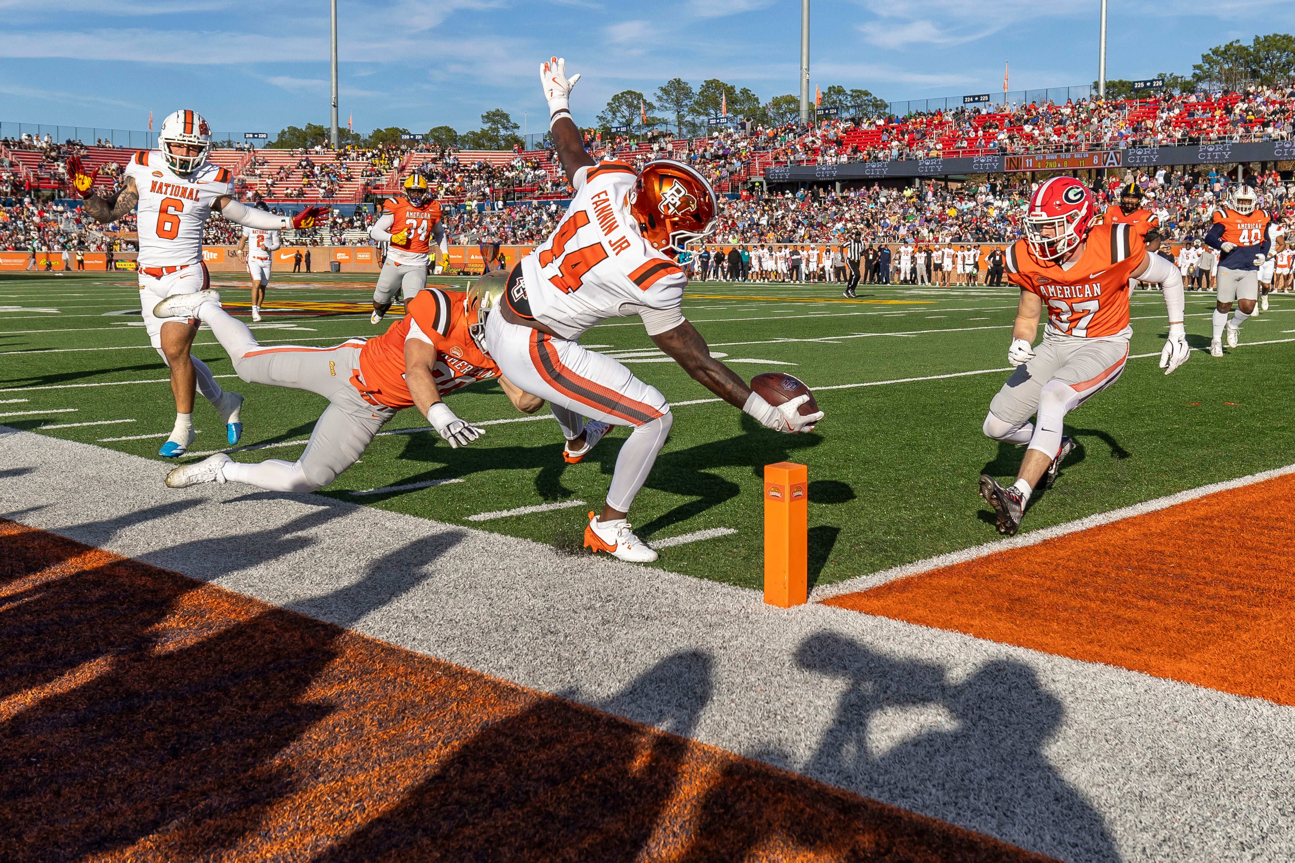 Feb 1, 2025; Mobile, AL, USA; National team tight end Harold Fannin Jr. of Bowling Green (44) attempts to score a touchdown against the American team during the second half of the 2025 Senior Bowl at Hancock Whitney Stadium.