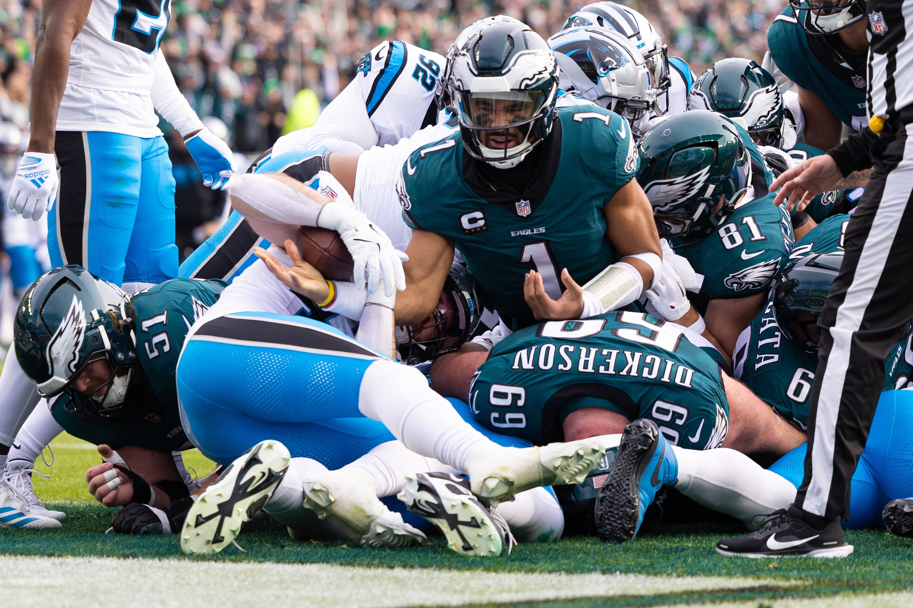 Dec 8, 2024; Philadelphia, Pennsylvania, USA; Philadelphia Eagles quarterback Jalen Hurts (1) reacts after scoring against the Carolina Panthers during the second quarter at Lincoln Financial Field.
