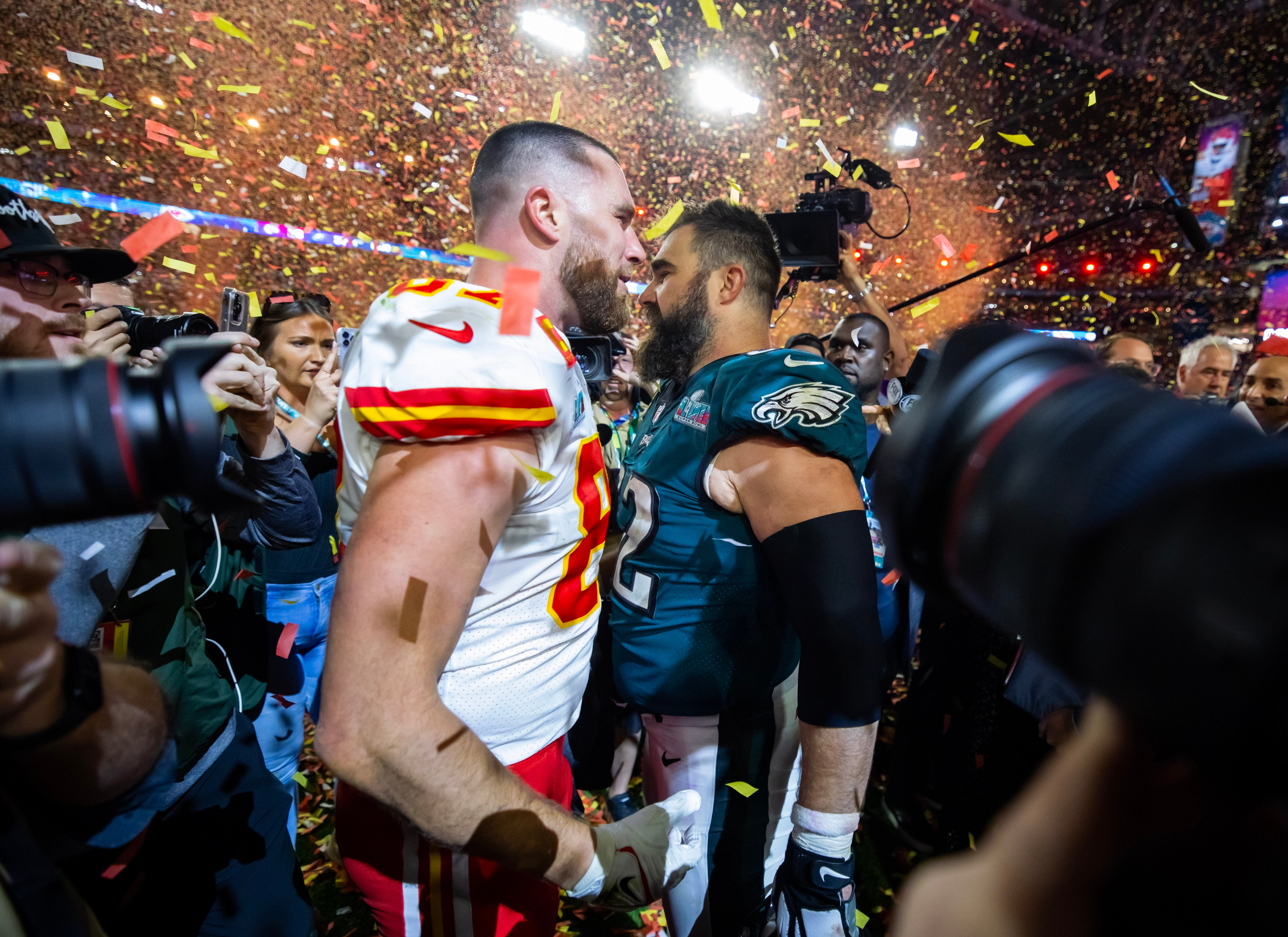 Feb 12, 2023; Glendale, Arizona, US; Kansas City Chiefs tight end Travis Kelce (87) talks with his brother Philadelphia Eagles center Jason Kelce (62) after Super Bowl LVII at State Farm Stadium.
