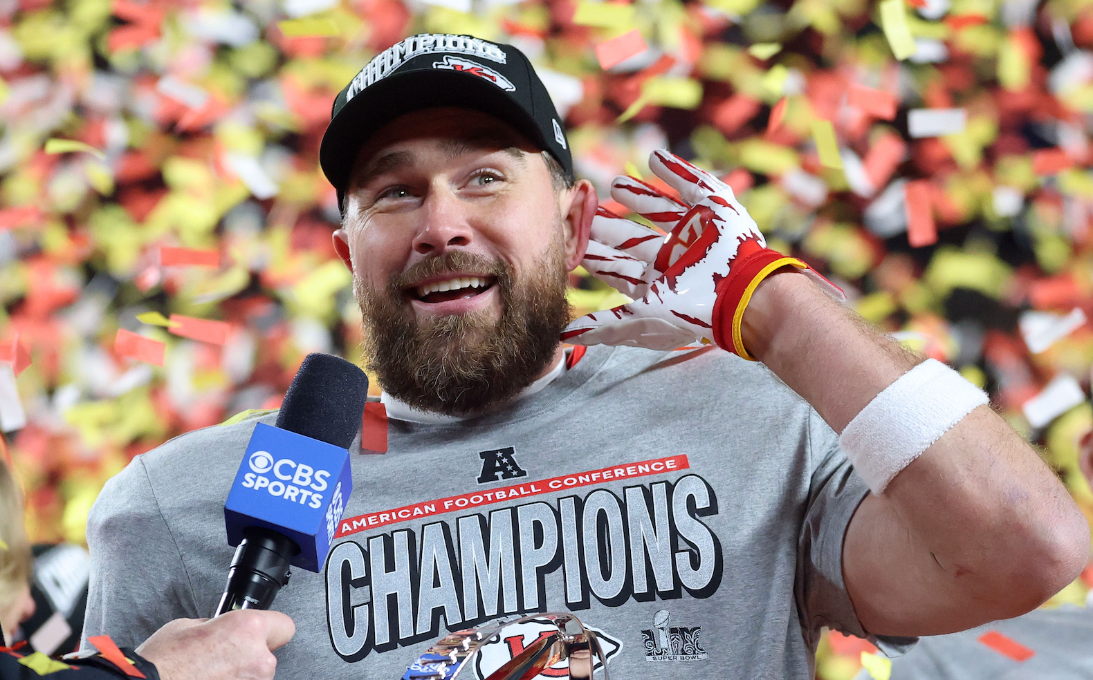 Jan 26, 2025; Kansas City, MO, USA; Kansas City Chiefs tight end Travis Kelce (87) reacts on stage after the AFC Championship game against the Buffalo Bills at GEHA Field at Arrowhead Stadium.