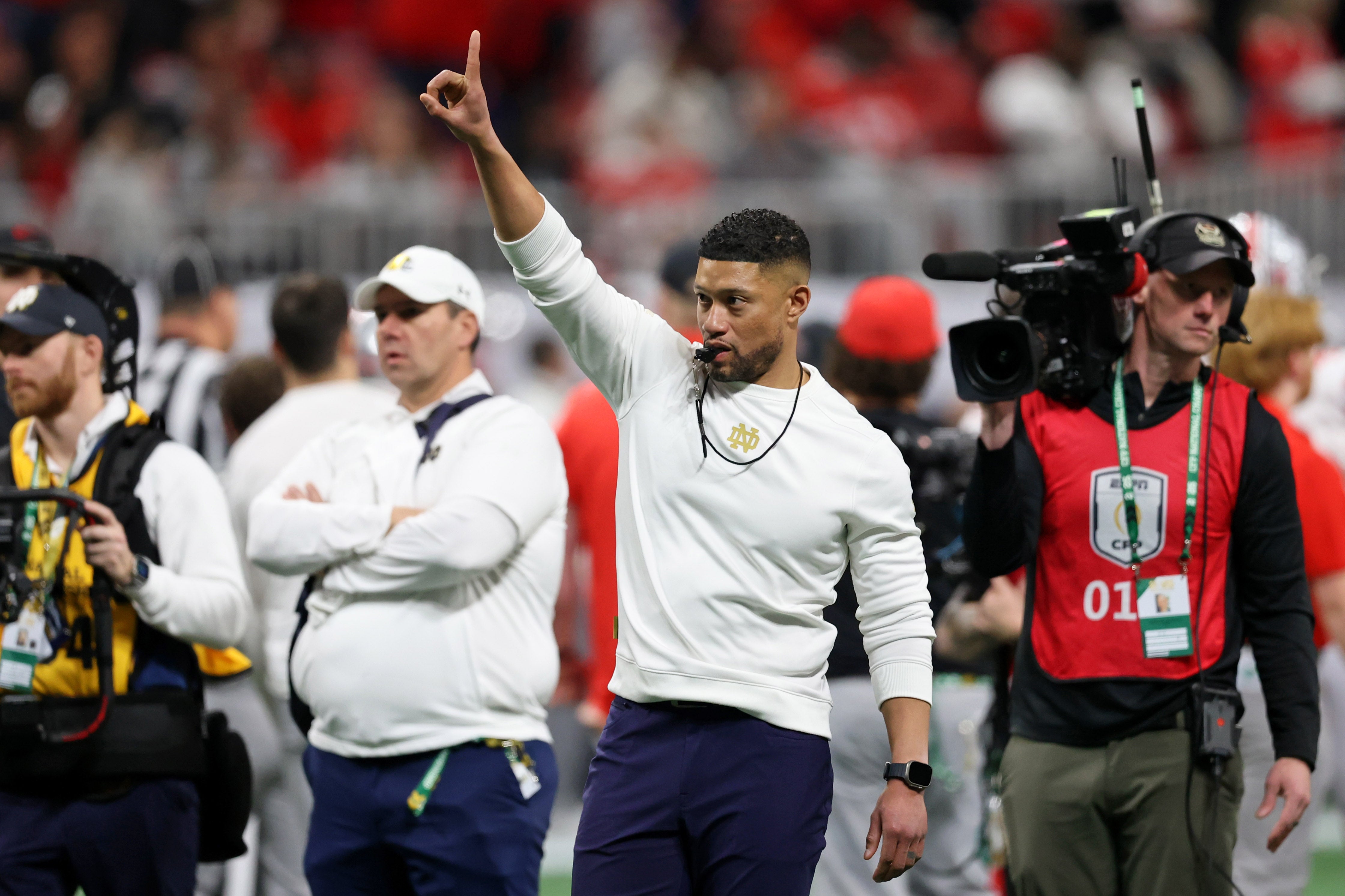 Notre Dame Fighting Irish head coach Marcus Freeman during warmups before the CFP National Championship college football game at Mercedes-Benz Stadium.