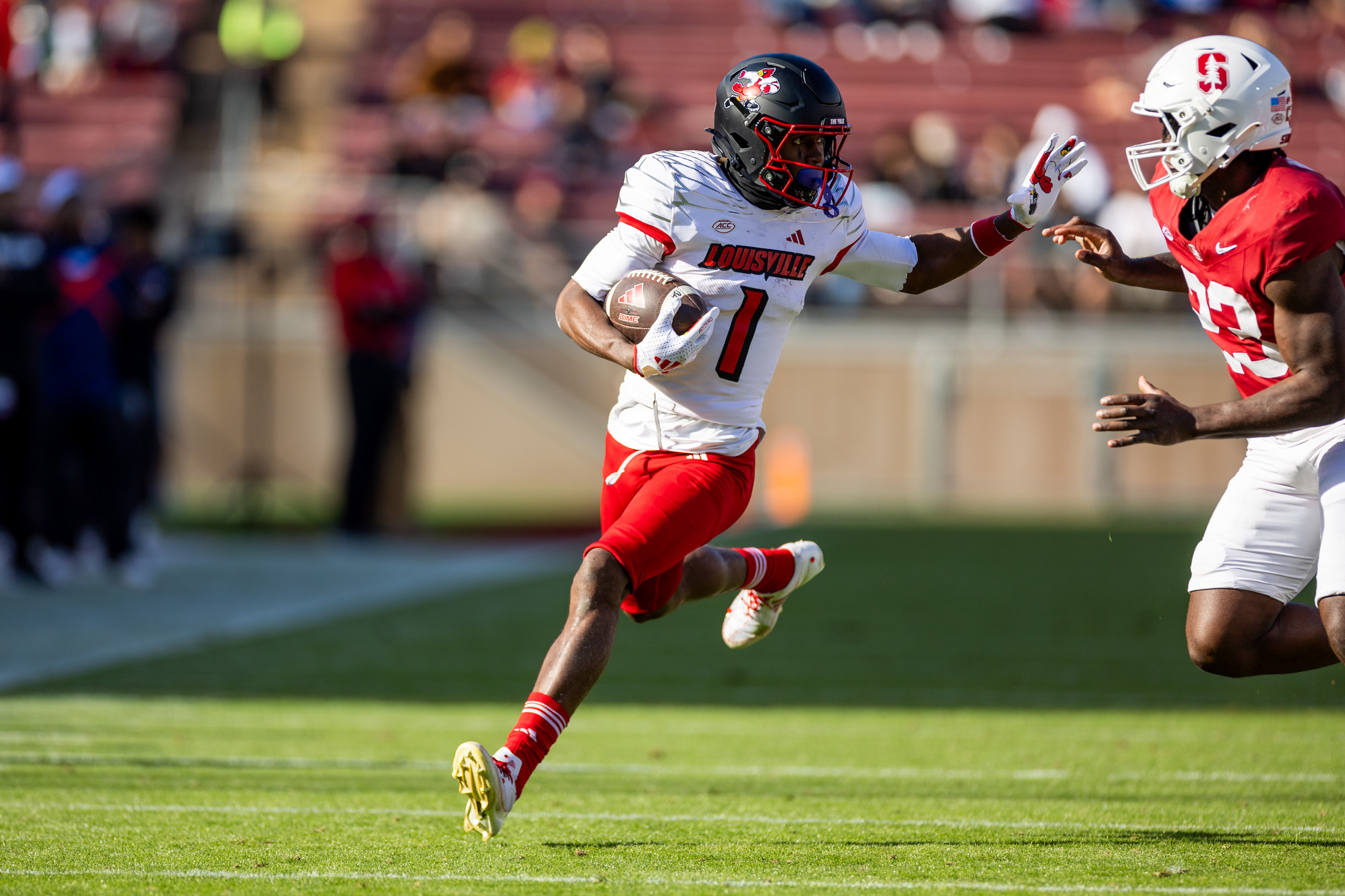 Louisville Cardinals wide receiver Ja'Corey Brooks (1) runs with the ball during the second quarter against the Stanford Cardinal at Stanford Stadium.