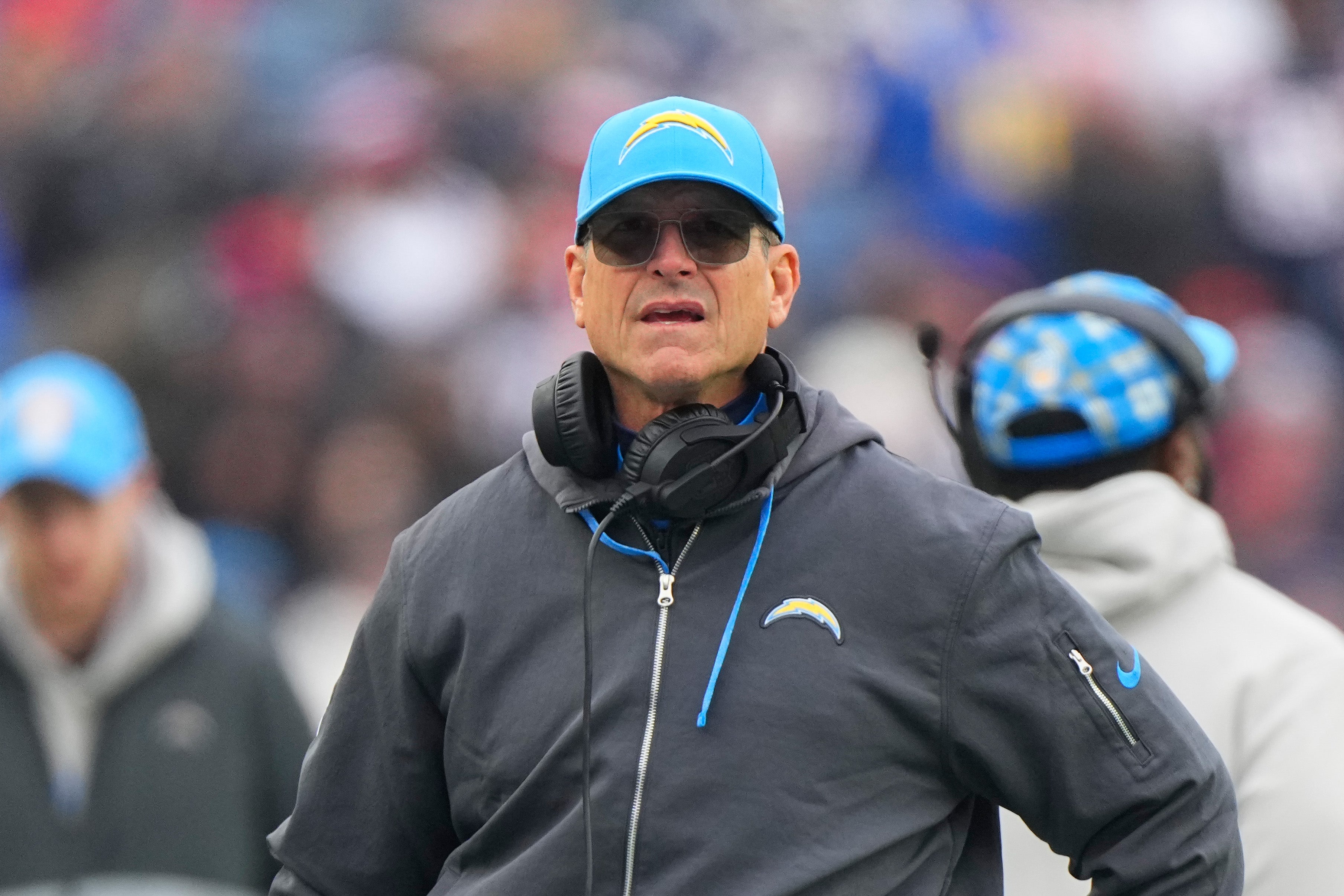 Dec 28, 2024; Foxborough, Massachusetts, USA; Los Angeles Chargers head coach Jim Harbaugh looks on from the sidelines during the first half against the New England Patriots at Gillette Stadium.