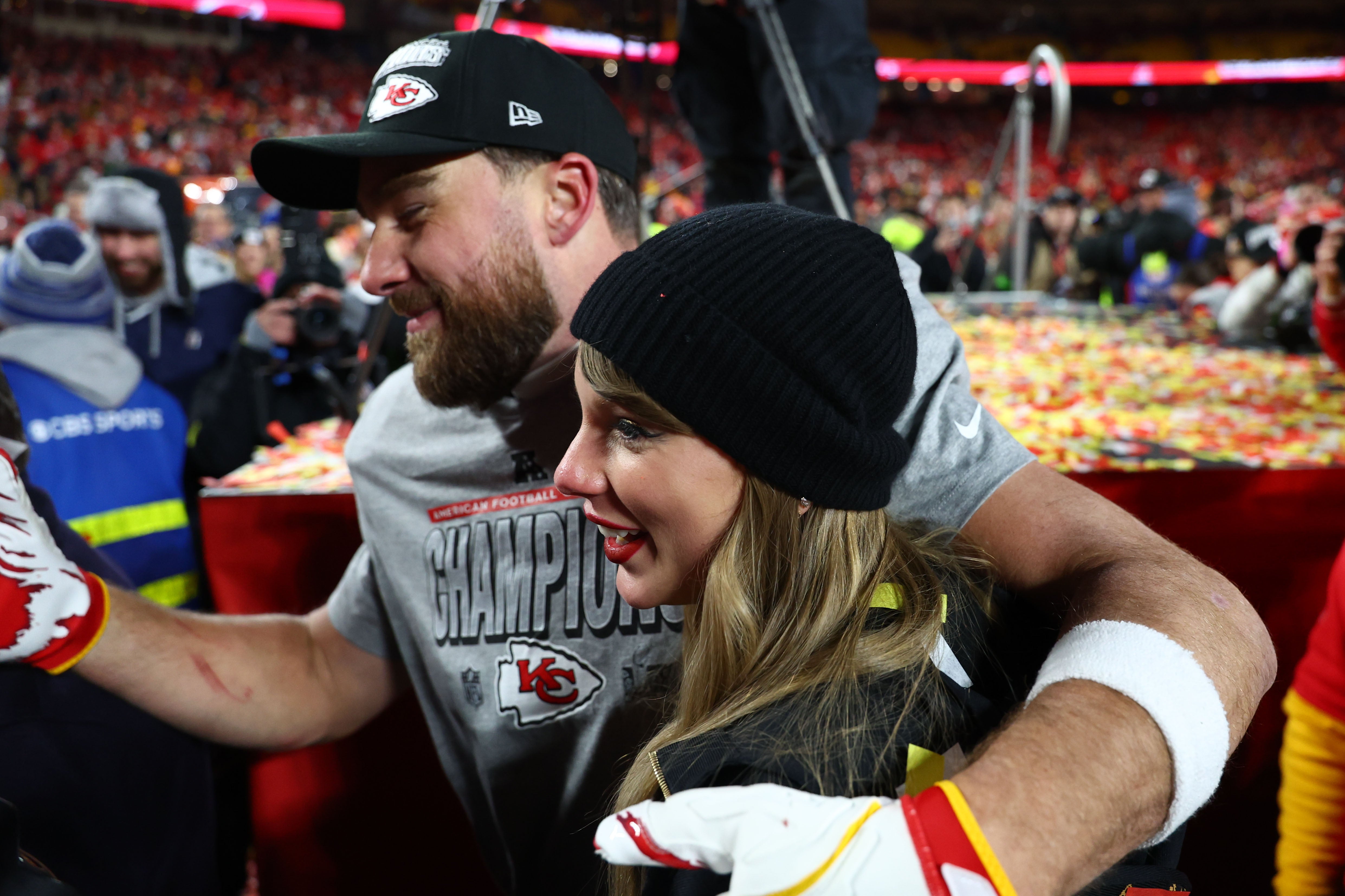 Jan 26, 2025; Kansas City, MO, USA; Recording artist Taylor Swift and Kansas City Chiefs tight end Travis Kelce (87) react after the AFC Championship game against the Buffalo Bills at GEHA Field at Arrowhead Stadium