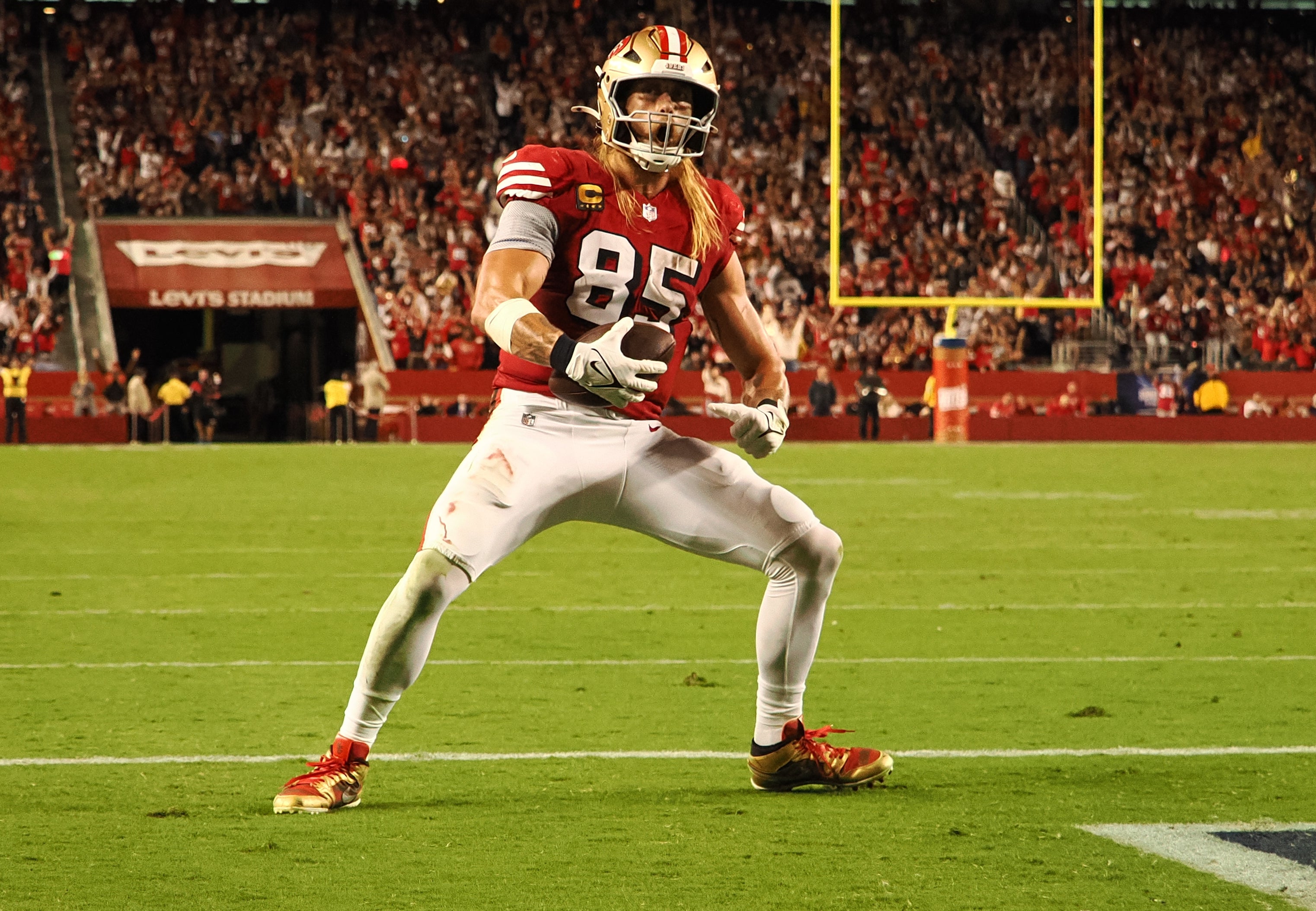 San Francisco 49ers tight end George Kittle (85) celebrates after scoring a touchdown against the Dallas Cowboys during the third quarter at Levi's Stadium.