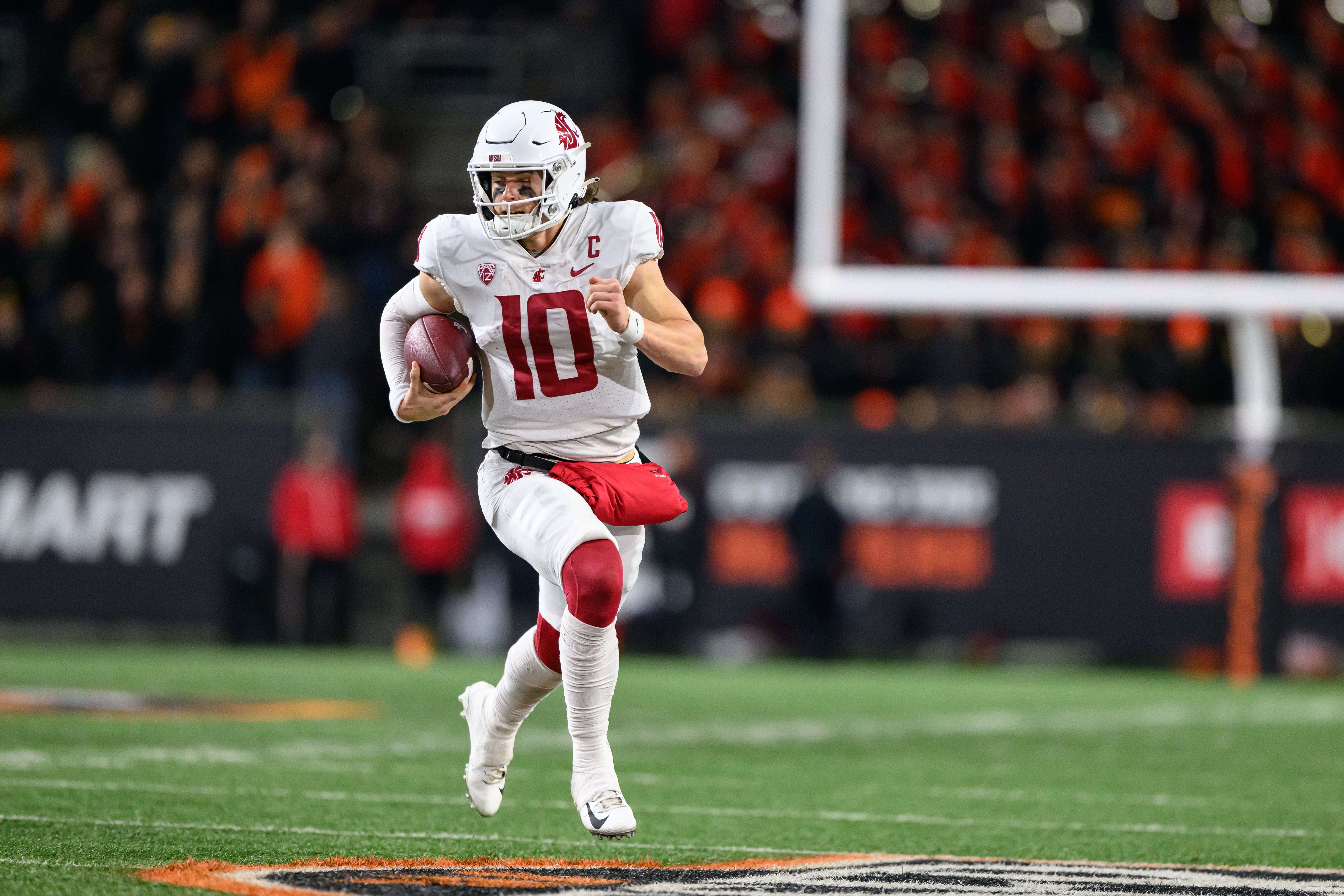 Nov 23, 2024; Corvallis, Oregon, USA; Washington State Cougars quarterback John Mateer (10) runs the ball during the fourth quarter against the Oregon State Beavers at Reser Stadium.
