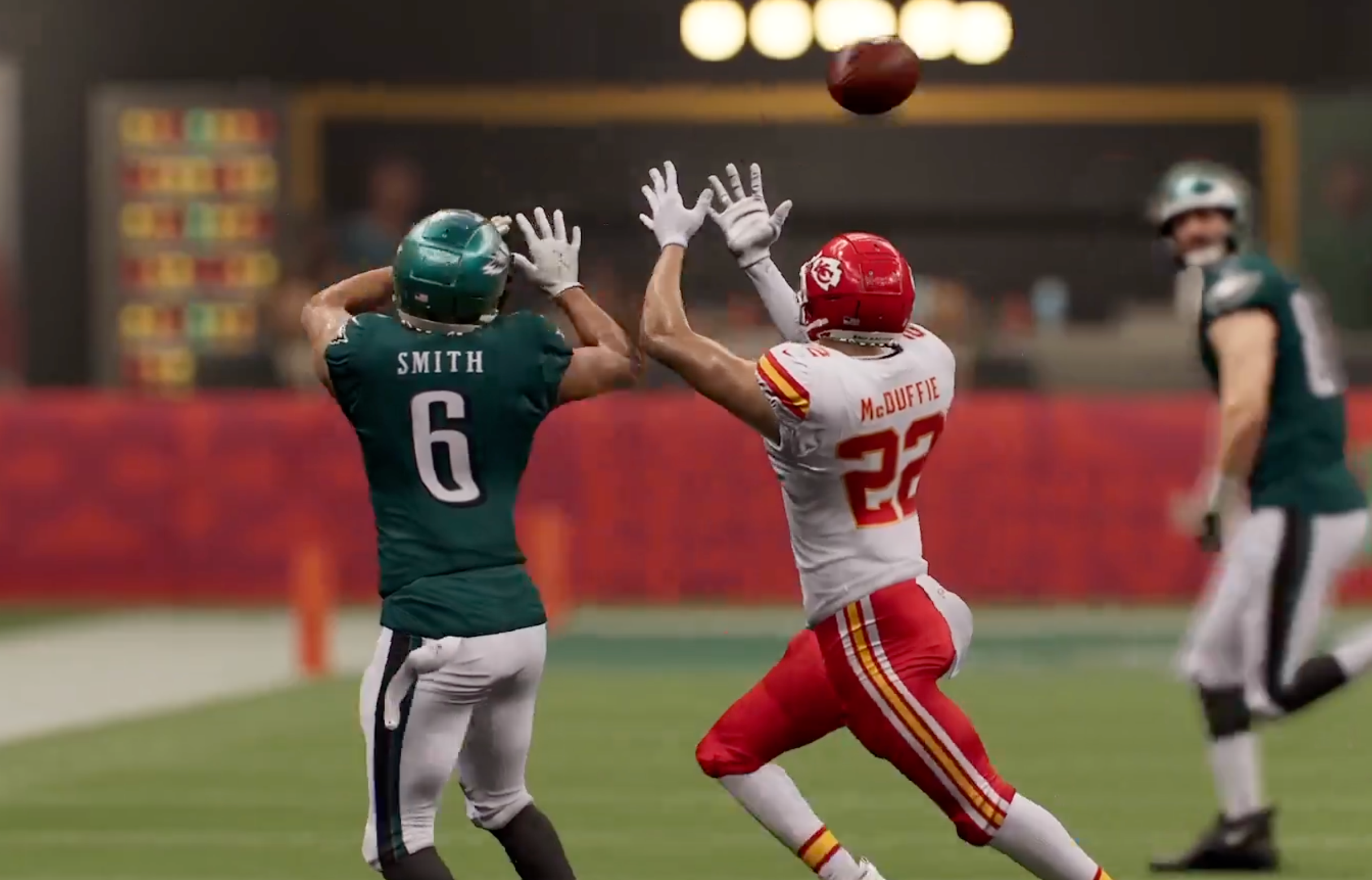 Trent McDuffie and Devonta Smith both attempt to haul in a pass from Philadelphia Eagles QB Jalen Hurts in Madden 25 video game Super Bowl LIX simulation.