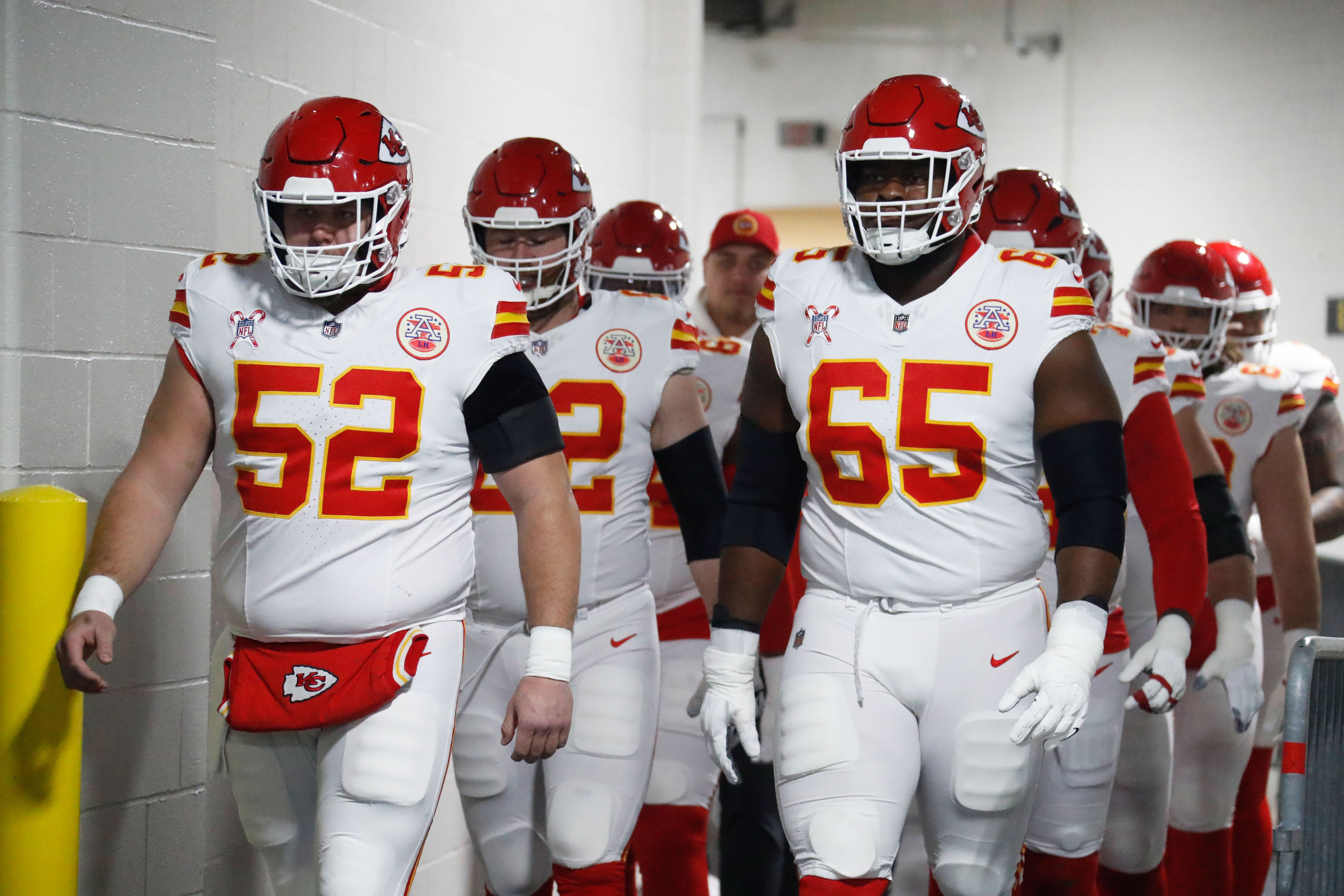 Dec 25, 2024; Pittsburgh, Pennsylvania, USA; Kansas City Chiefs center Creed Humphrey (52) and guard Trey Smith (65) walk to the field to warm up against the Pittsburgh Steelers at Acrisure Stadium.