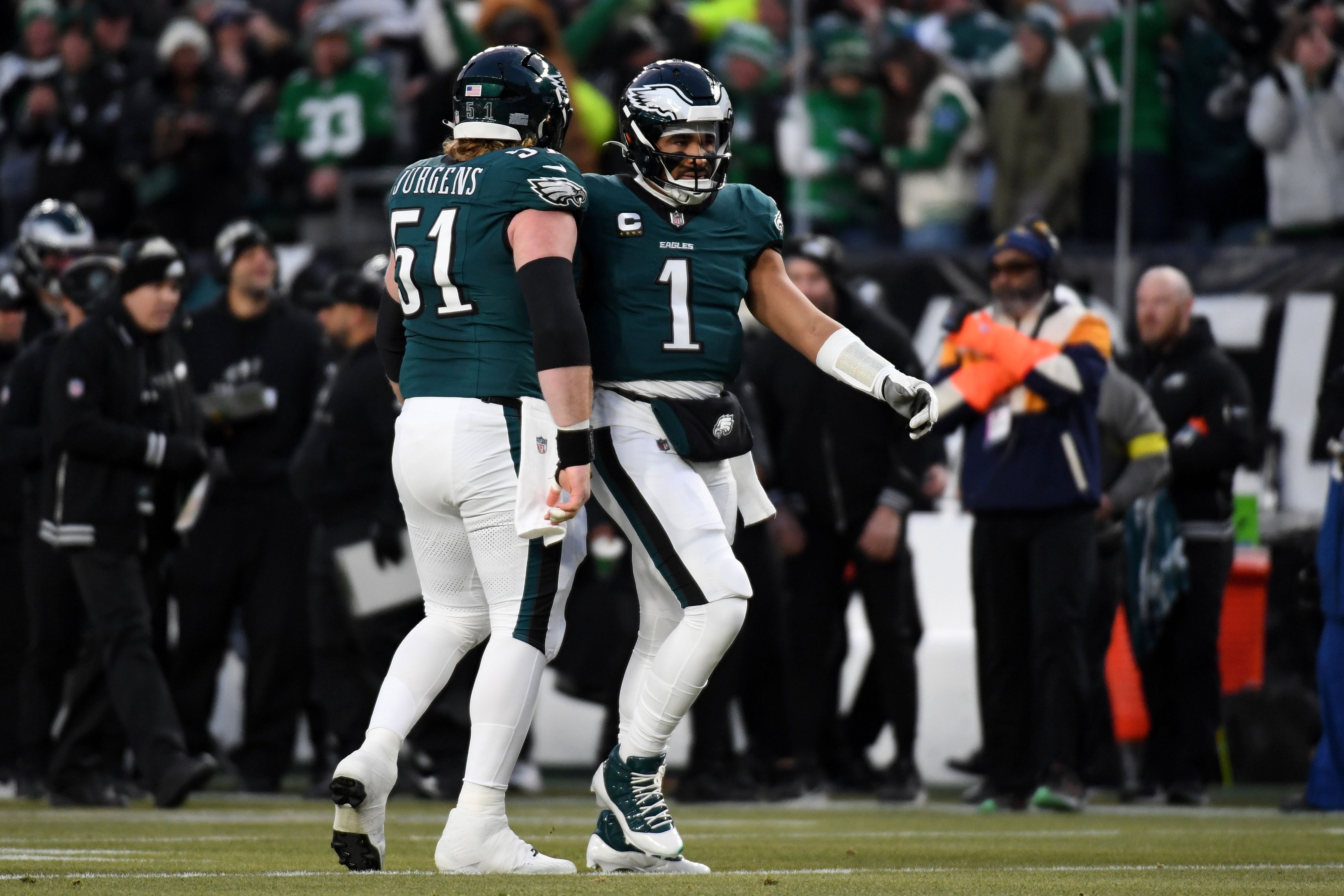 Philadelphia Eagles quarterback Jalen Hurts (1) reacts with center Cam Jurgens (51) during the first half in an NFC wild card game at Lincoln Financial Field.